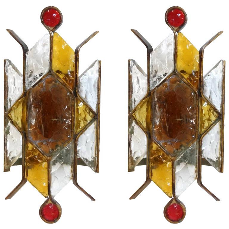 A pair of sconces in multicolor glass with brass details and hardware in the style of Poliarte.

Italian, Circa 1970's