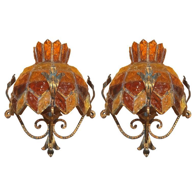 A pair of sconces in multicolor glass with brass details and hardware in the style of Poliarte.

Italian, Circa 1970s

Two (2) Pairs Are Available.