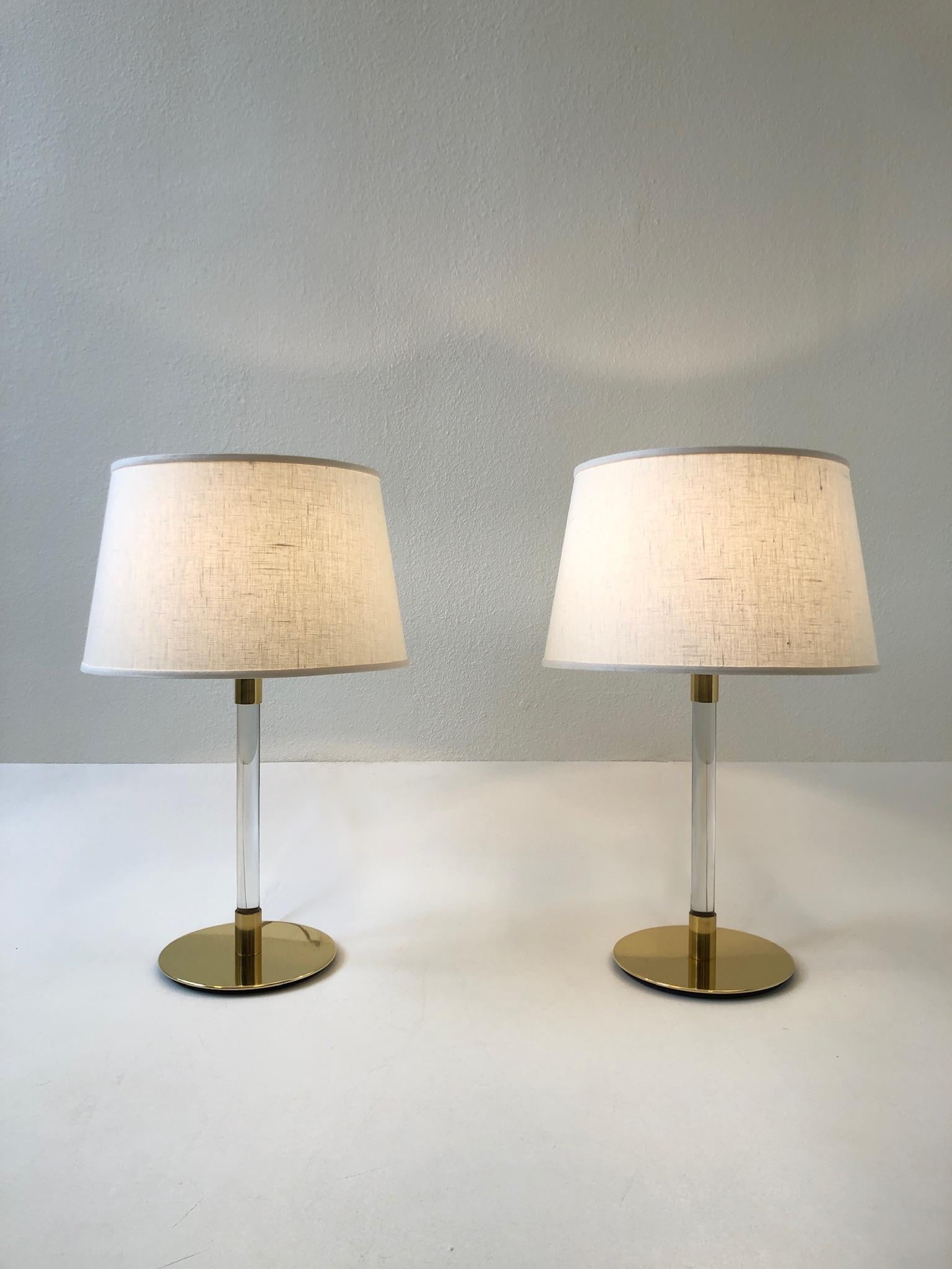 A beautiful pair of polish brass and clear glass table lamps design by Hansen Lamps New York and made in Spain by Metalarte.
The lamps show minor wear consistent with age (see detail photos).
New vanilla linen shades.
Measurements: 16.25”