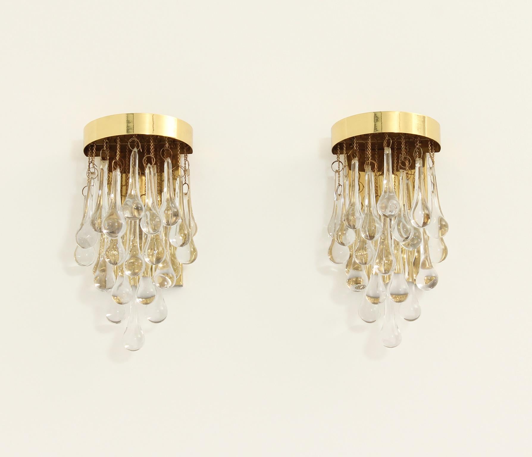 Pair of glass teardrop sconces from 1970's by Lumica, Spain. Brass structure with teardrops in clear glass.