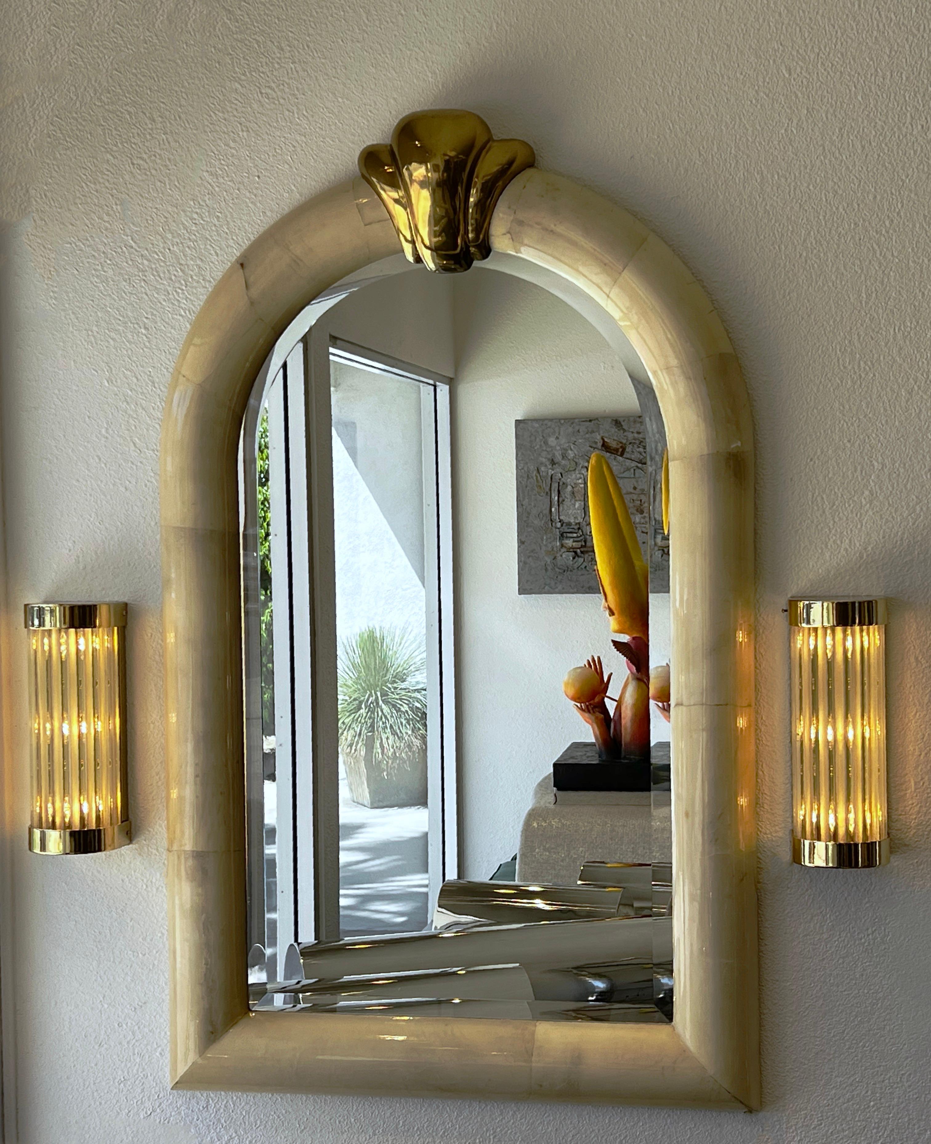1980’s pair of polish brass and glass wall sconces by Louis Baldinger & Sons. 
Constructed of solid brass with clear and frosted glass rods on the shade. 
In beautiful vintage condition.
They take three 60w max candelabra size bulbs.