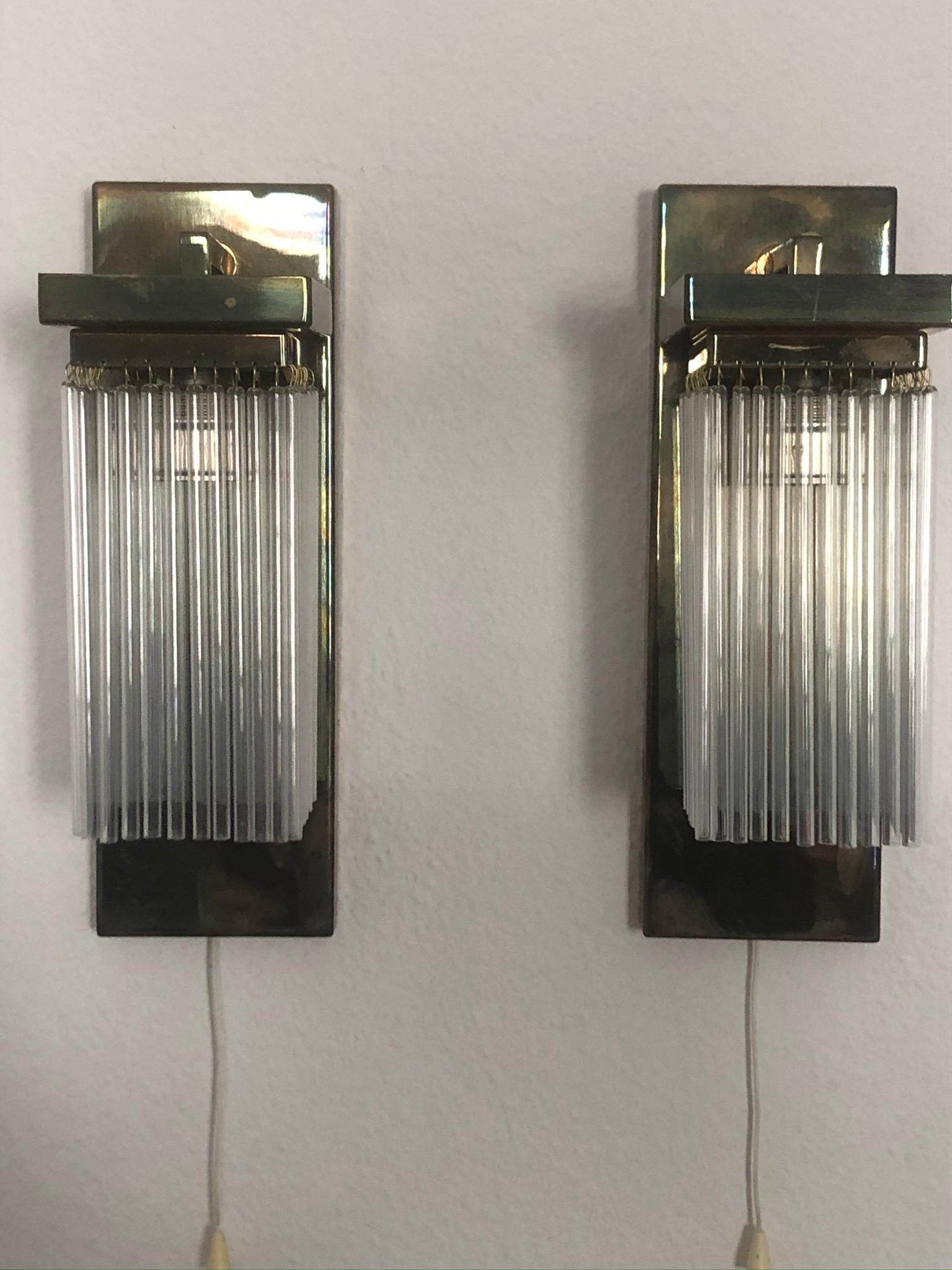 A beautiful and very elegant pair of brass and glass wall sconces in the style of Koloman Moser and Otto Wagner,
circa 1990s, Austria, Vienna.
The sconces needs each one x E27 standard screw bulbs for illuminate.
Excellent condition.