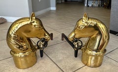 Paire de chenets équestres en laiton et en fer