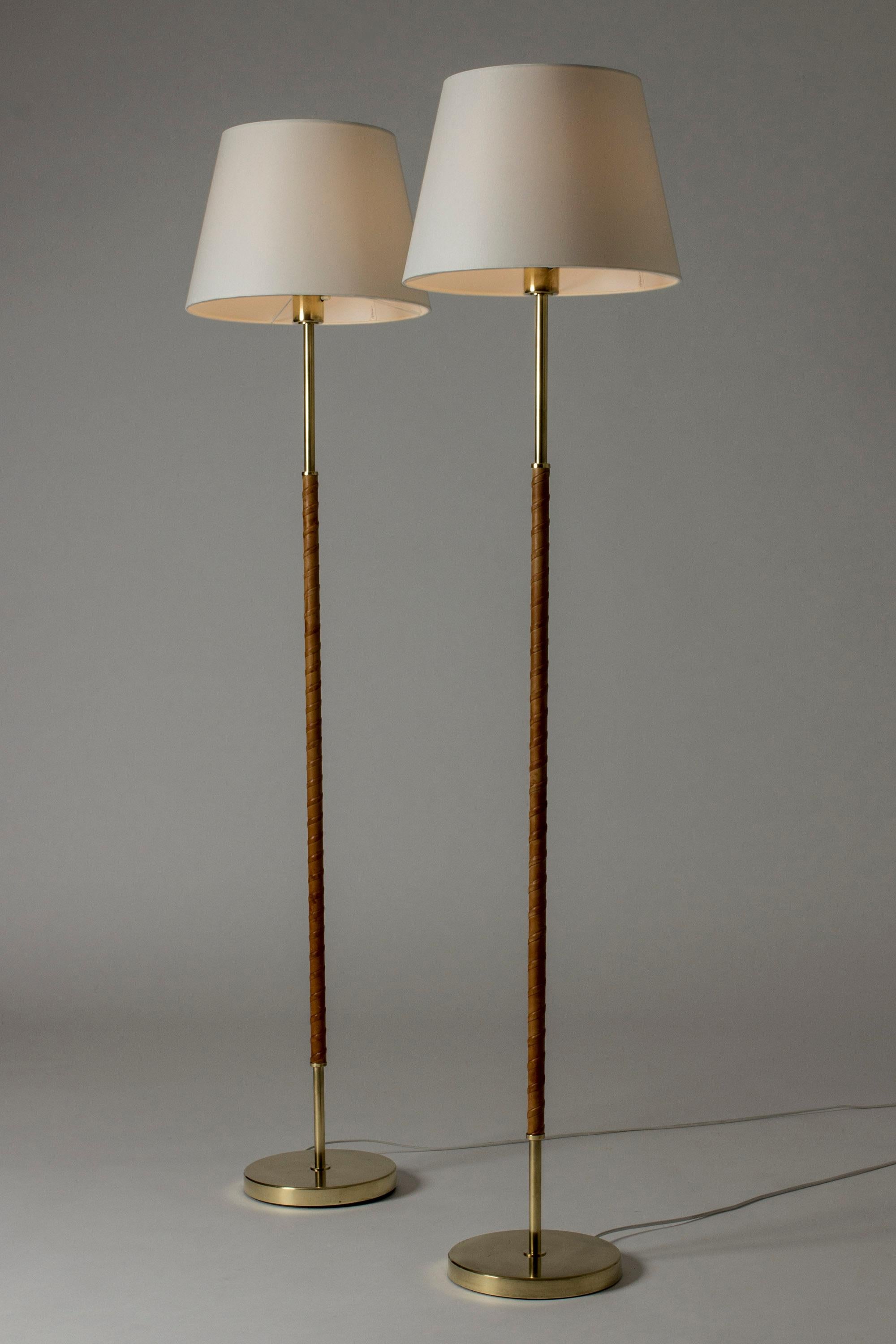 Swedish Pair of Brass and Leather Floor Lamps from Böhlmarks, Sweden, 1950s