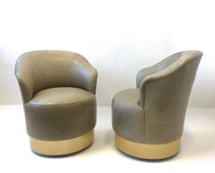 Pair of Brass and Leather Swivel Chairs by J. Robert Scott
