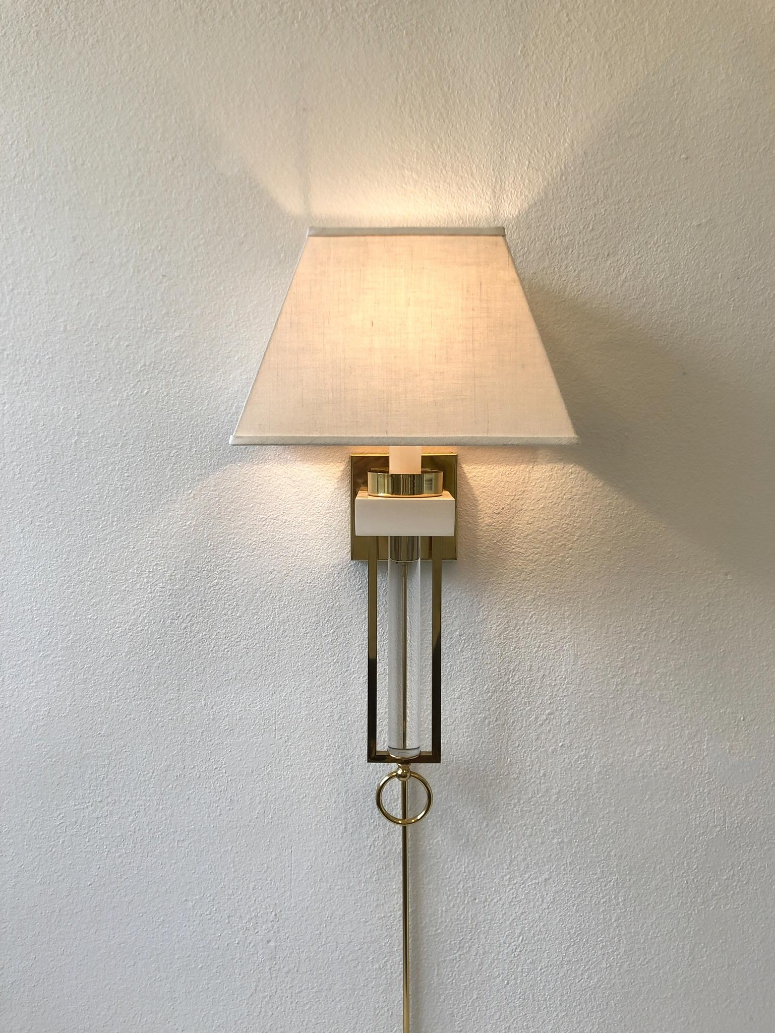 Hollywood Regency Pair of Brass and Lucite Wall Sconces For Sale