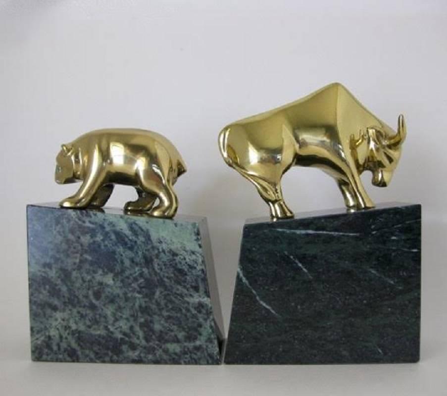 Pair of vintage, solid brass and green marble bear and bull wall street-themed bookends. Very heavy and well made. The bull measures 5