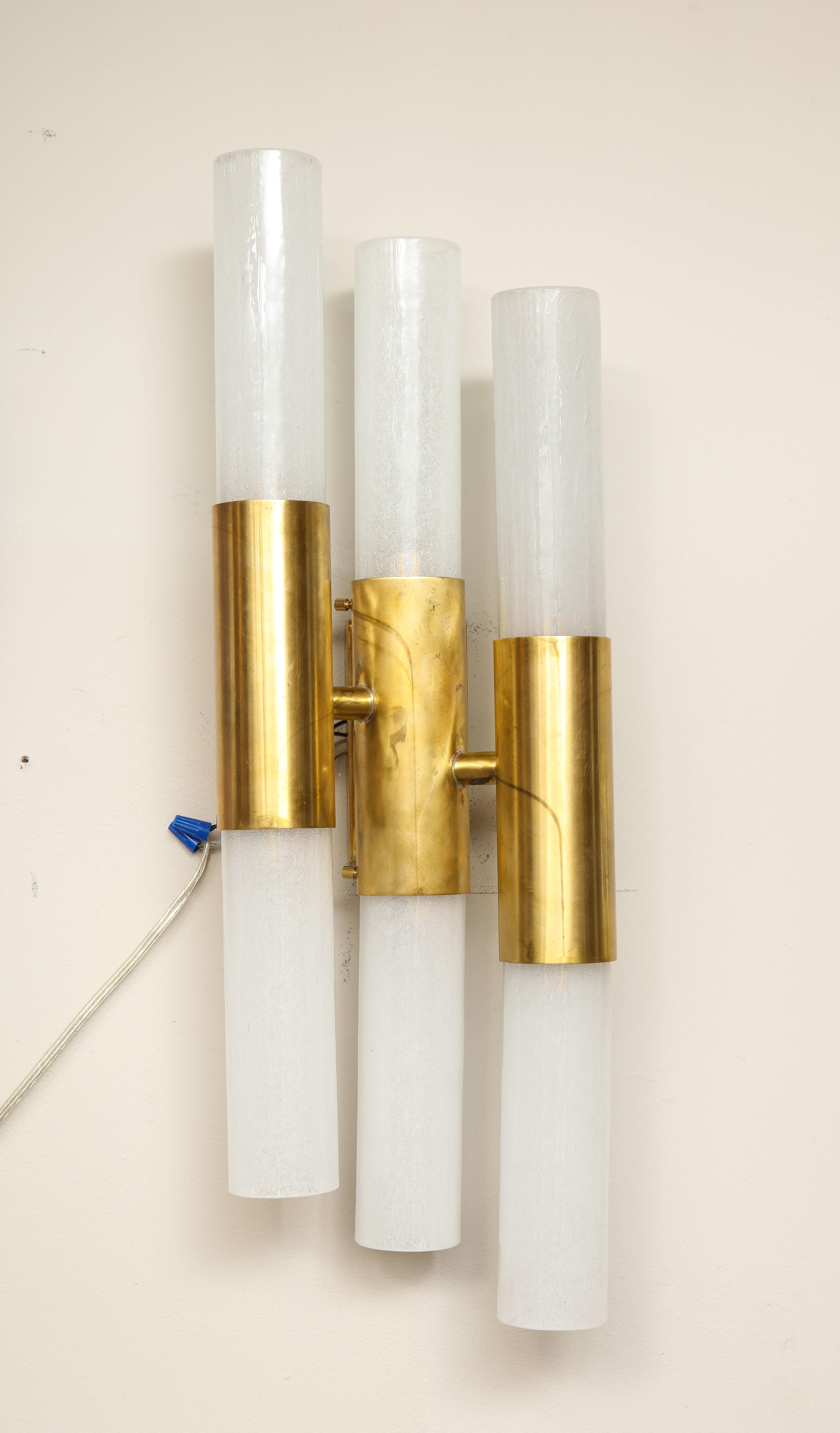 This pair of new Italian brass and Murano opaline glass sconces are available for purchase immediately. Custom finishes are also available.