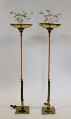 Pair of Brass and Rattan Floor Lamps in the style of Paavo Tynell
