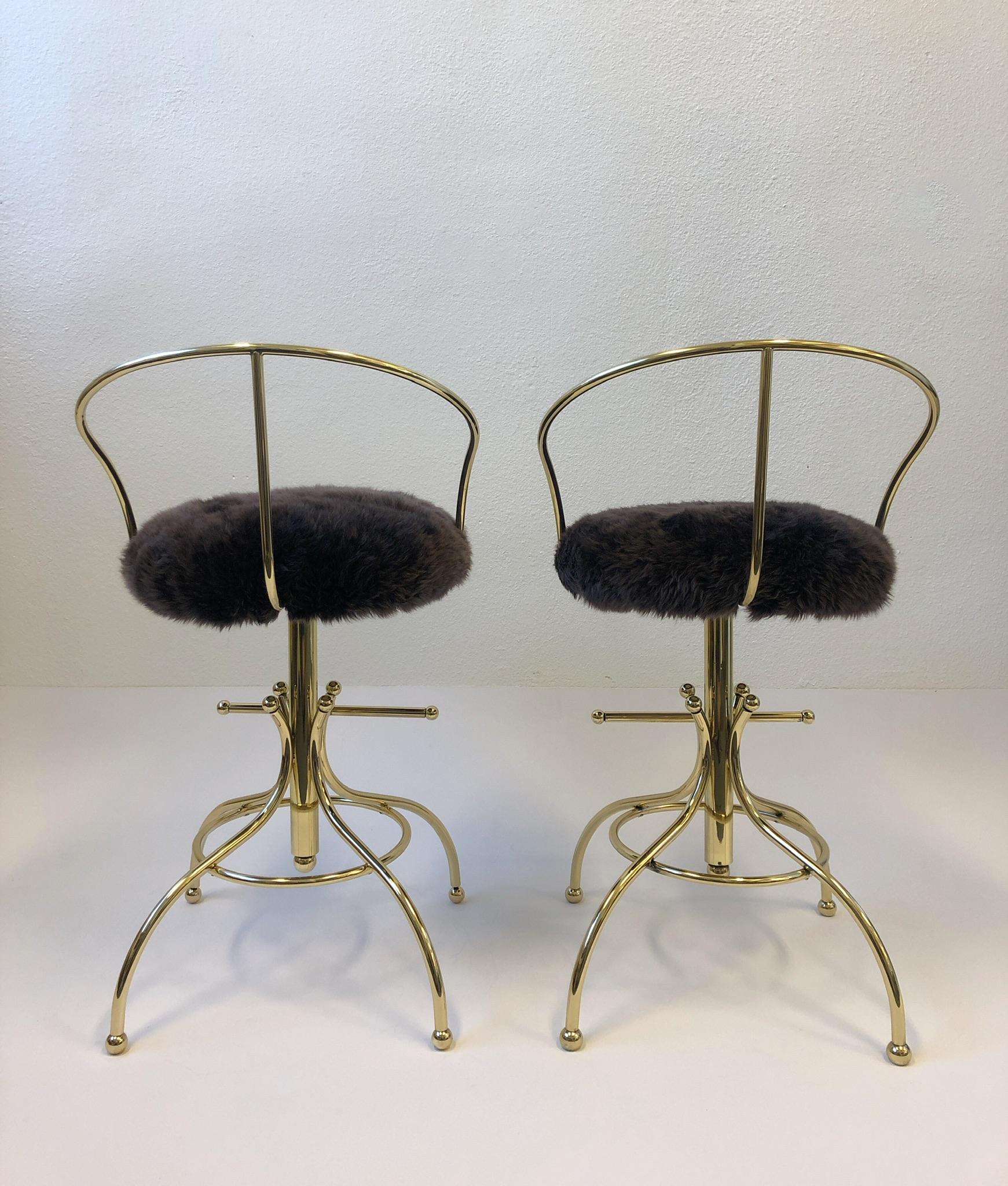 American Pair of Brass and Sheepskin Swivel Barstools by Charles Hollis Jones For Sale