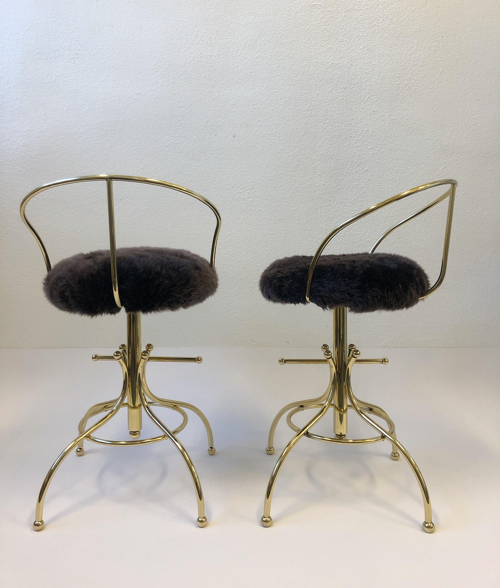 Polished Pair of Brass and Sheepskin Swivel Barstools by Charles Hollis Jones For Sale