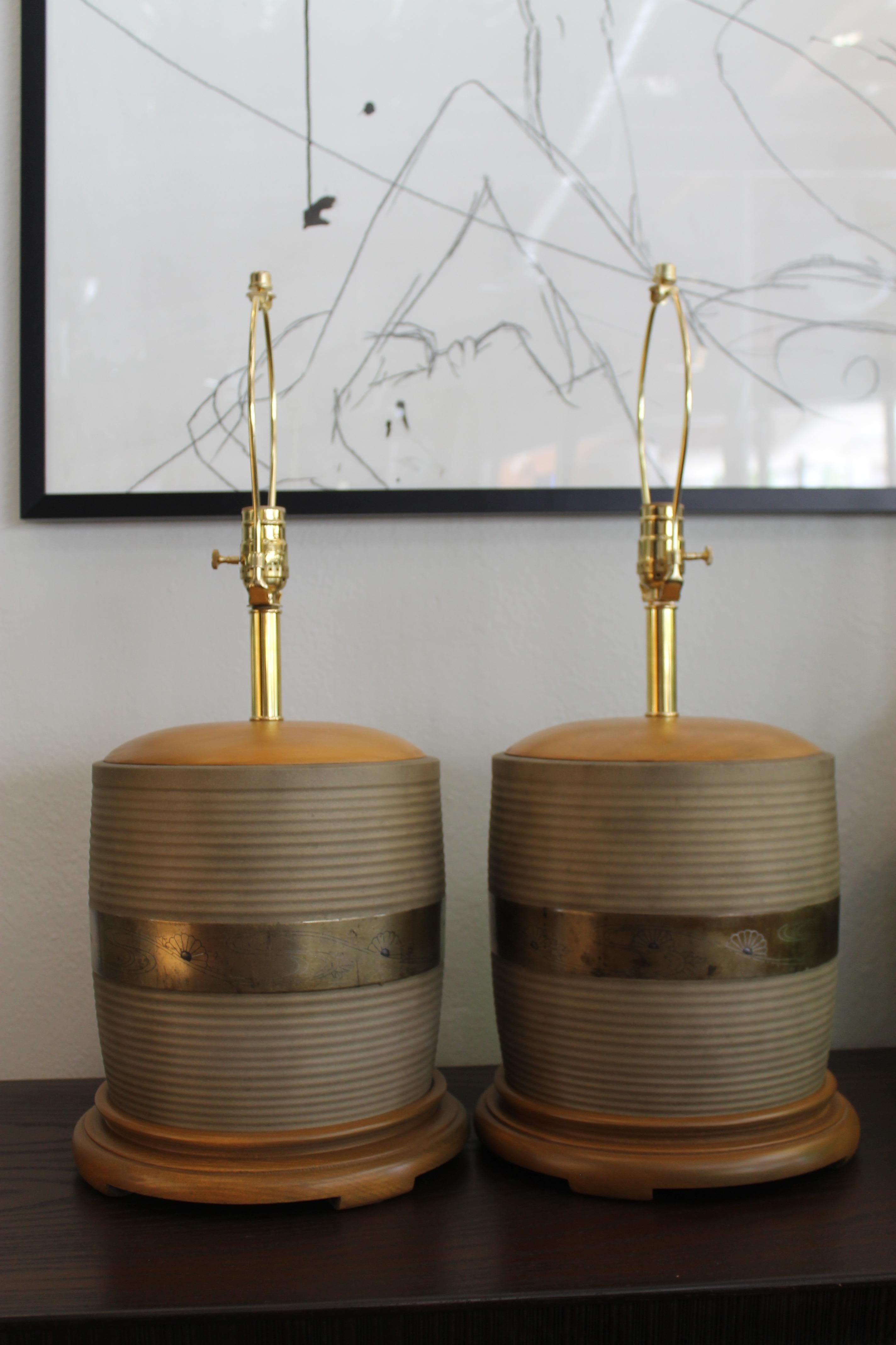 Pair of brass with silver inlay lamps. Middle brass portion is 9.25