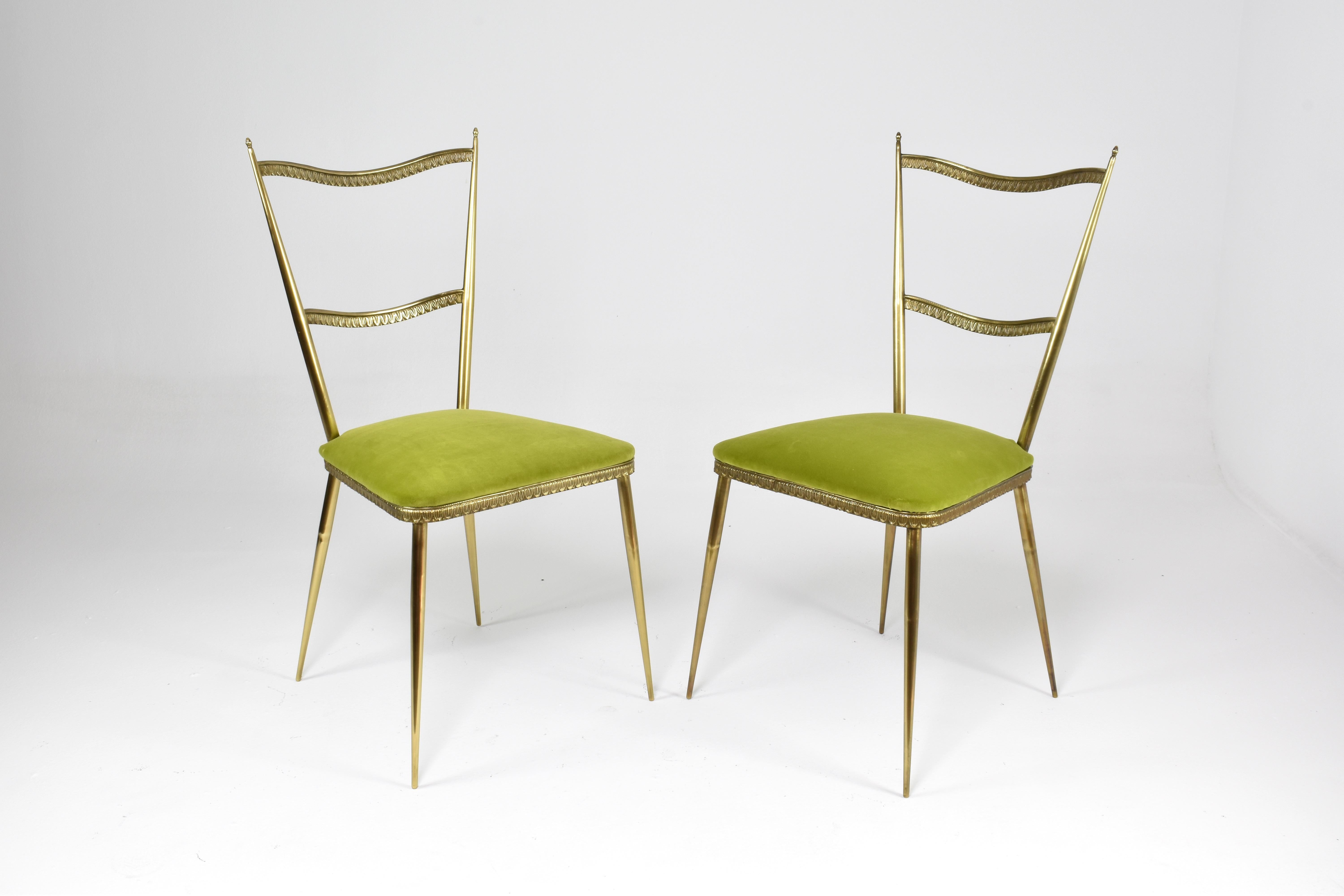A striking pair of Italian side chairs with a gracefully tapered brass frame and sculptural ladder backrest. The re-upholstered lime green velvet seat cushions add a playful yet elegant contrast. 

These chairs reflect the revival of mid-century