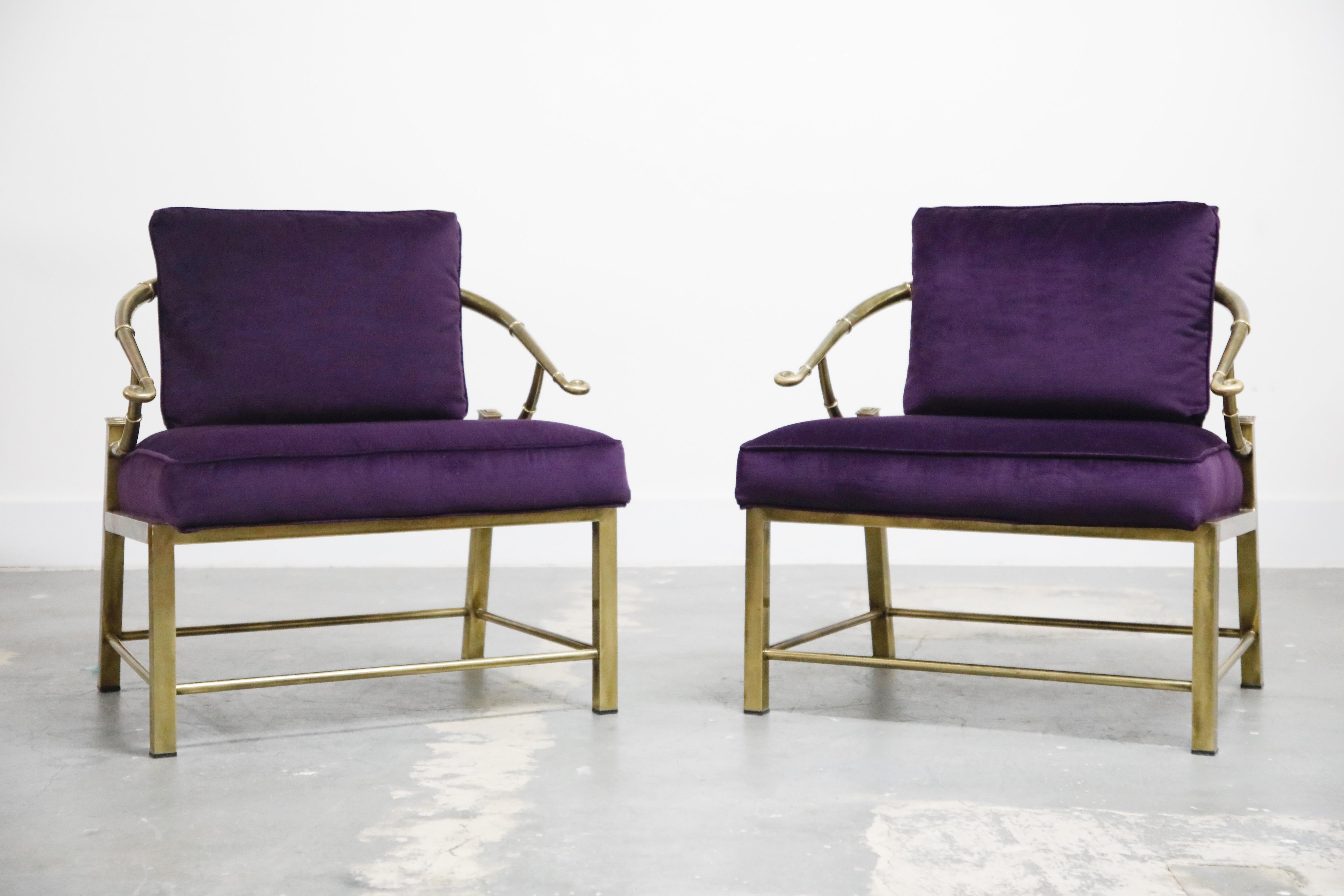 This beautiful pair of lightly patinated brass slipper chairs by Mastercraft has been newly upholstered in a sumptuous purple velvet fabric and signed underneath with Made in Italy labels. This pair of empress chairs by Mastercraft shares design