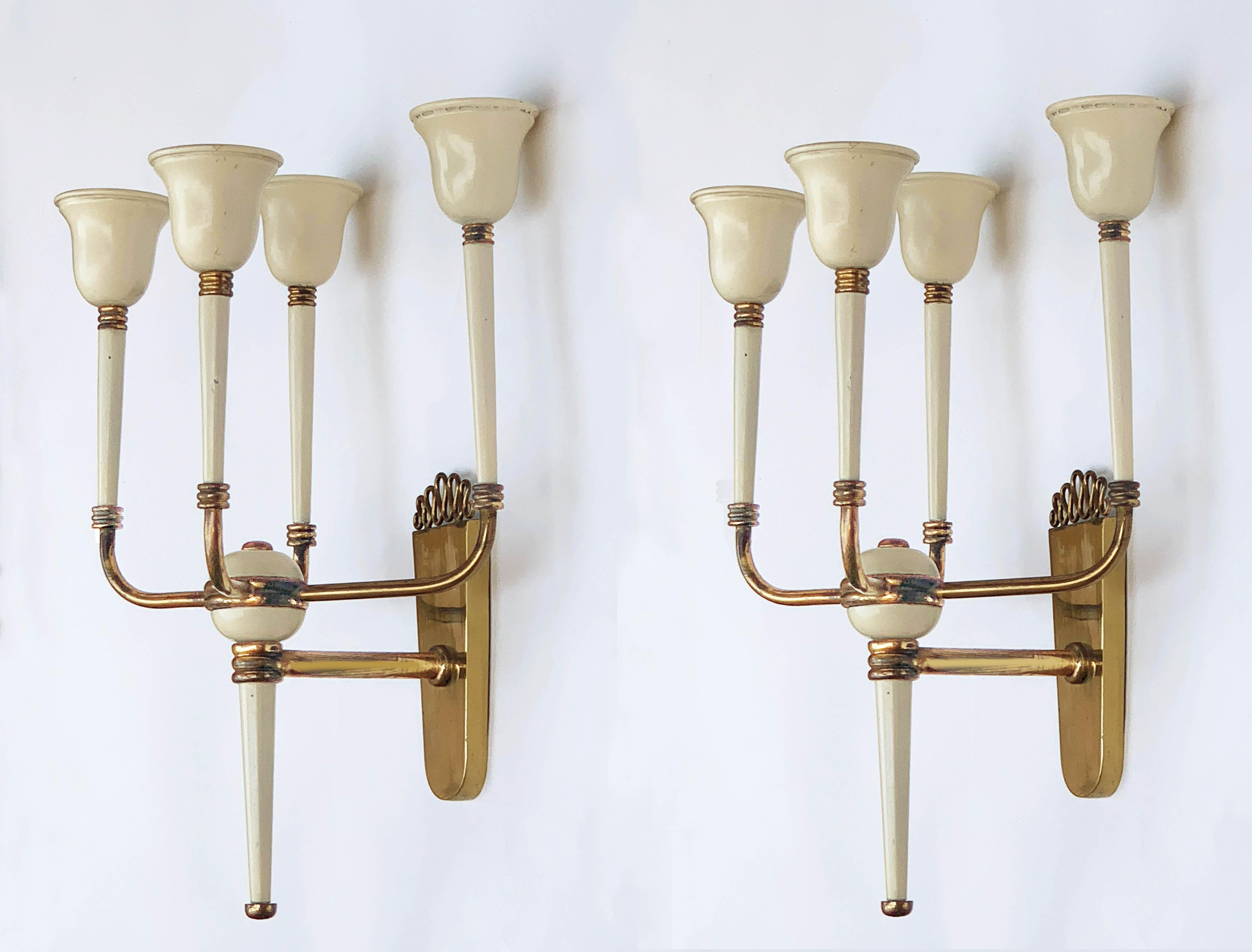 Amazing pair of brass and Ivory white enameled cones. The design of these items is attributed to Guglielmo Ulrich and they were produced in Italy during 1940s.

These pieces have four arms mounting E 14 bulbs and are a clear Art Deco example of