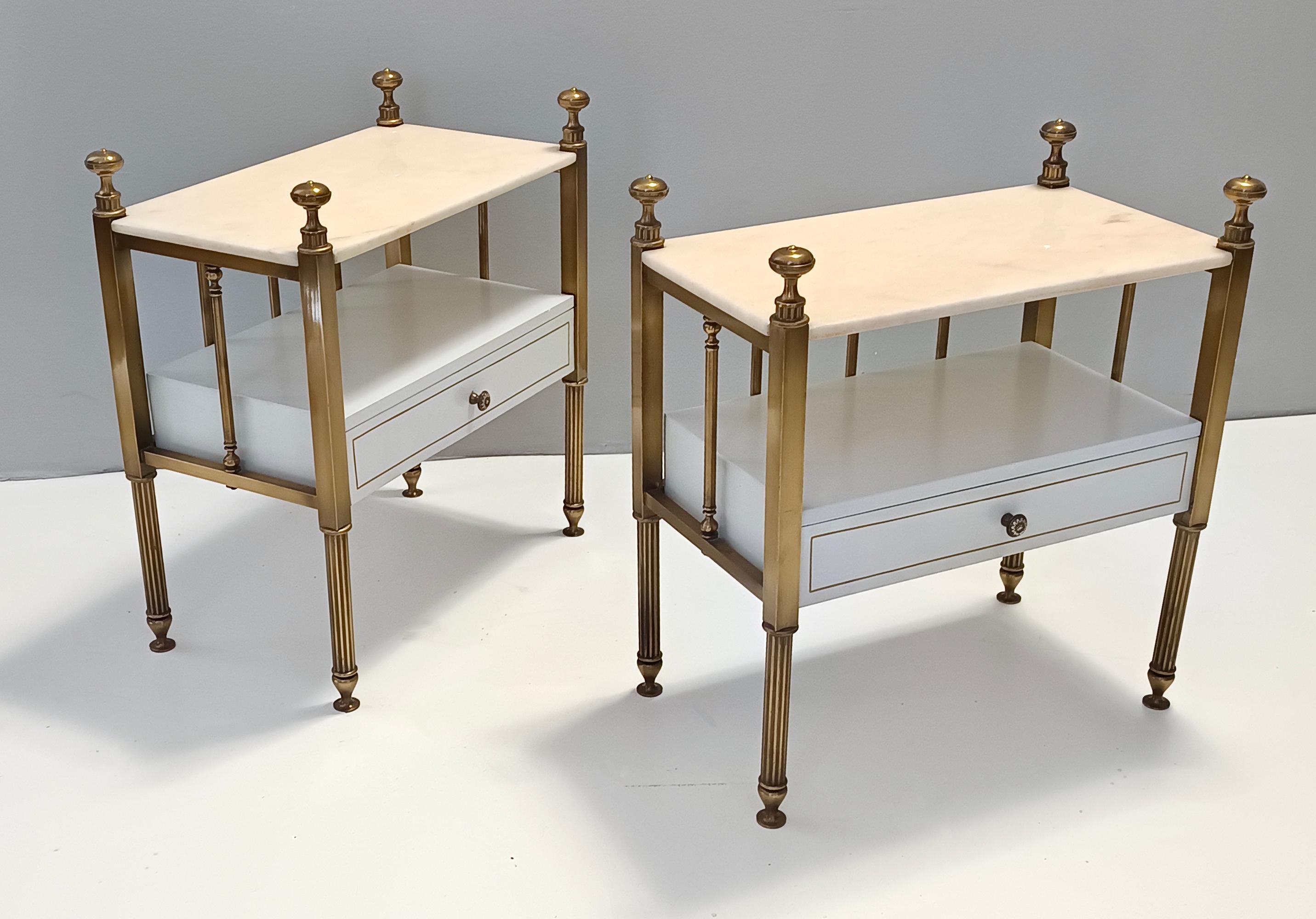 Made in Italy, 1970s.
They feature a white lacquered beech frame, brass legs and handles and Portuguese pink marble tops.
These nightstands are vintage therefore they might show slight traces of use such as their original patina, but they can be