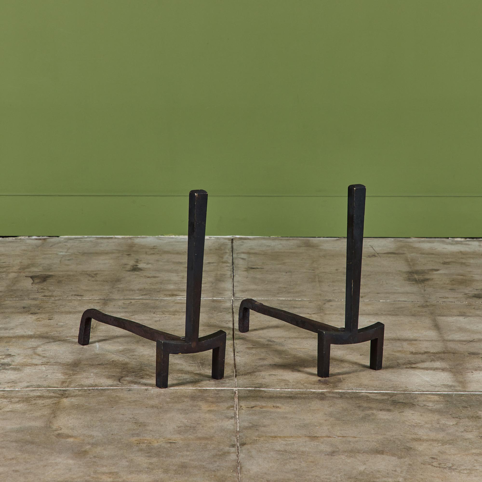 Pair of brass andirons for Saarinen Swanson Group by J. Robert Swanson, Pipsan Swanson Saarinen and Eliel Saarinen, c.1940s, USA. 

Pipsan, part of the famous Saarinen created this pair of andirons along side her husband Robert Swanson under her