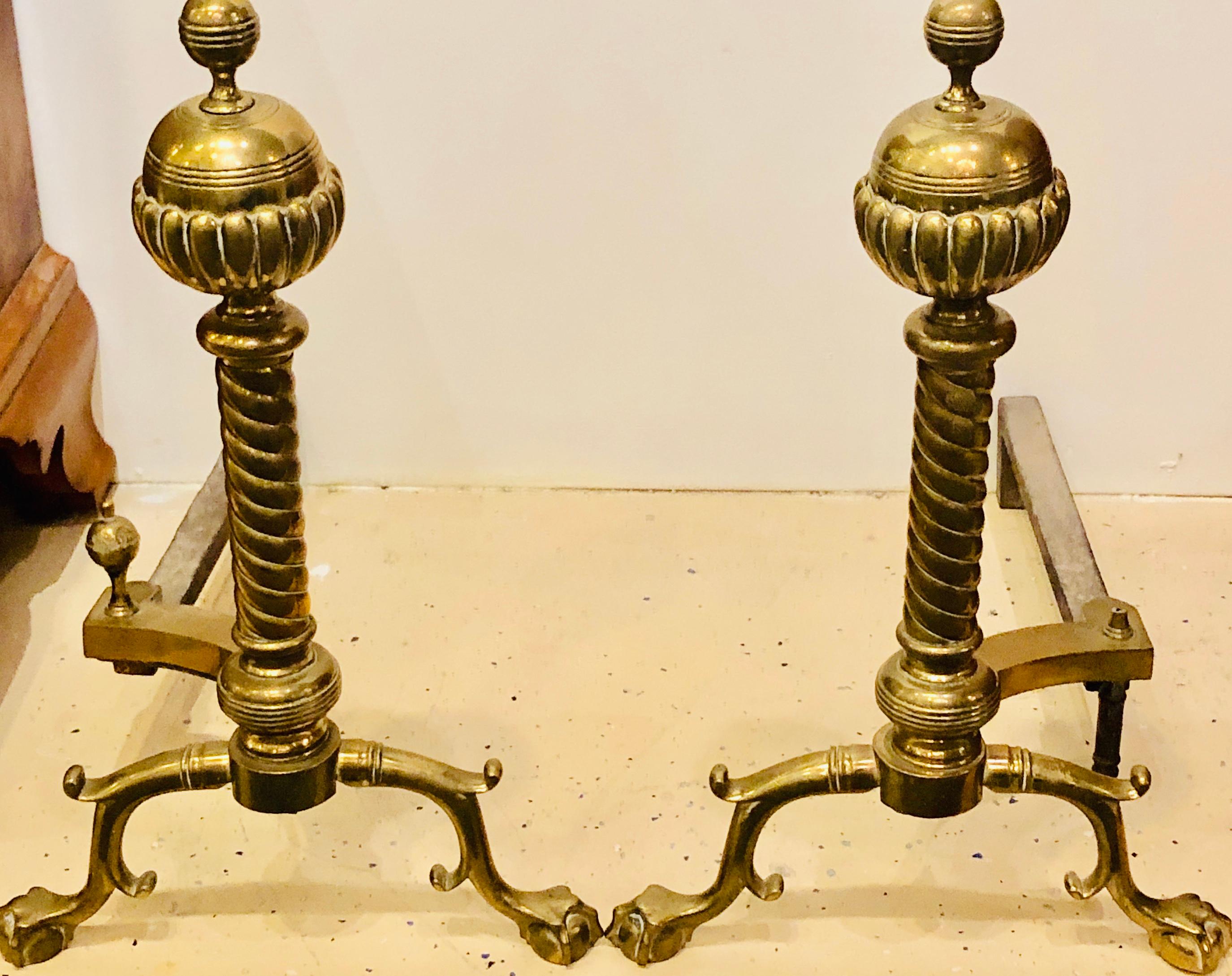 Pair of brass andirons circa 1880 ball and claw feet of twisted column-form.