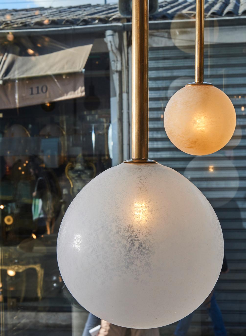 Frosted Pair of Brass Angular Chandeliers with Glass Globes