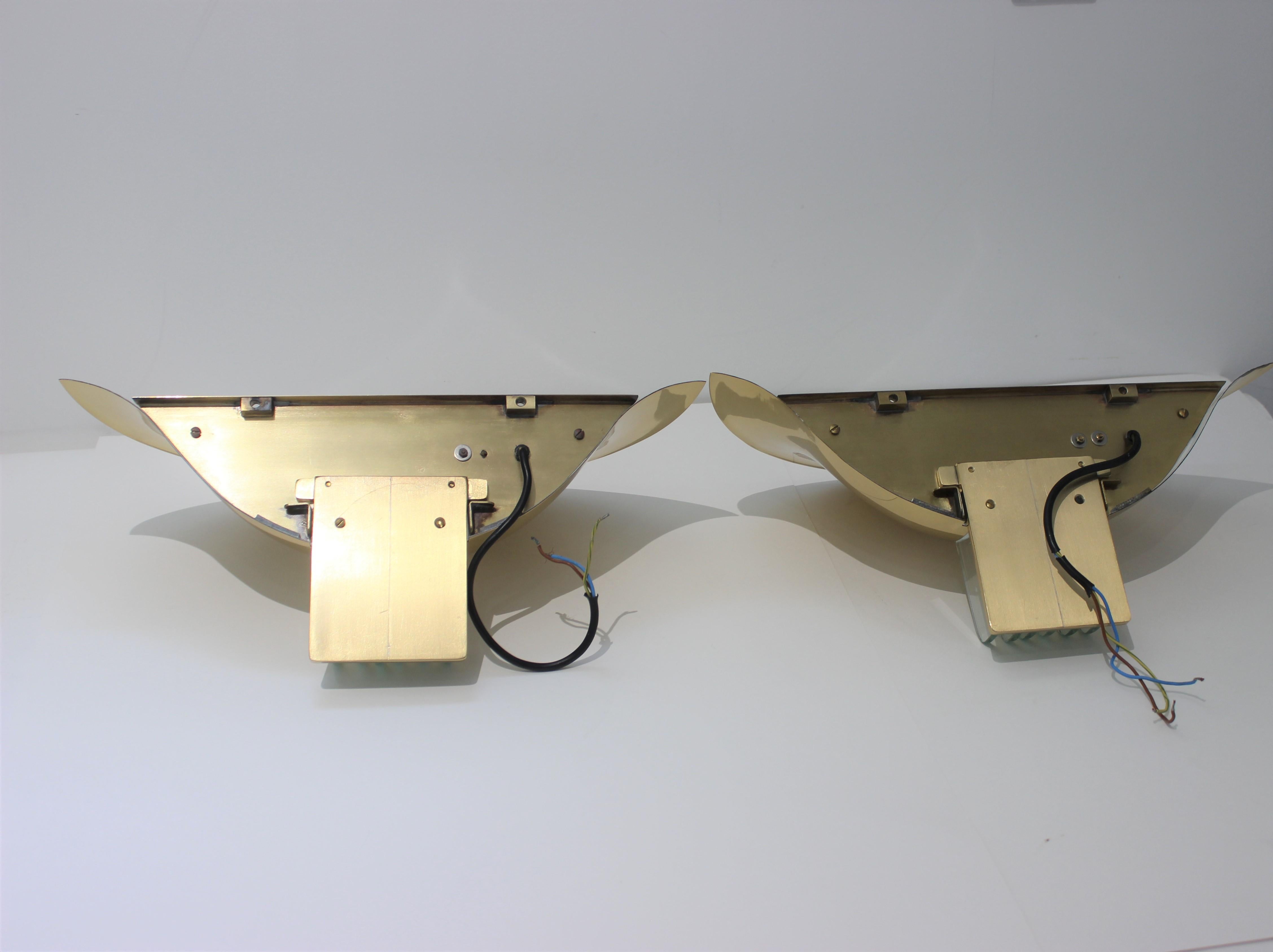 This stylish set of Art Deco style wall sconces have have taken their inspiration of pieces created in the 1920s-1930s and then the 1970s-1980s with the Art Deco revival and designer such as Karl Springer 

Note: The pieces have been
