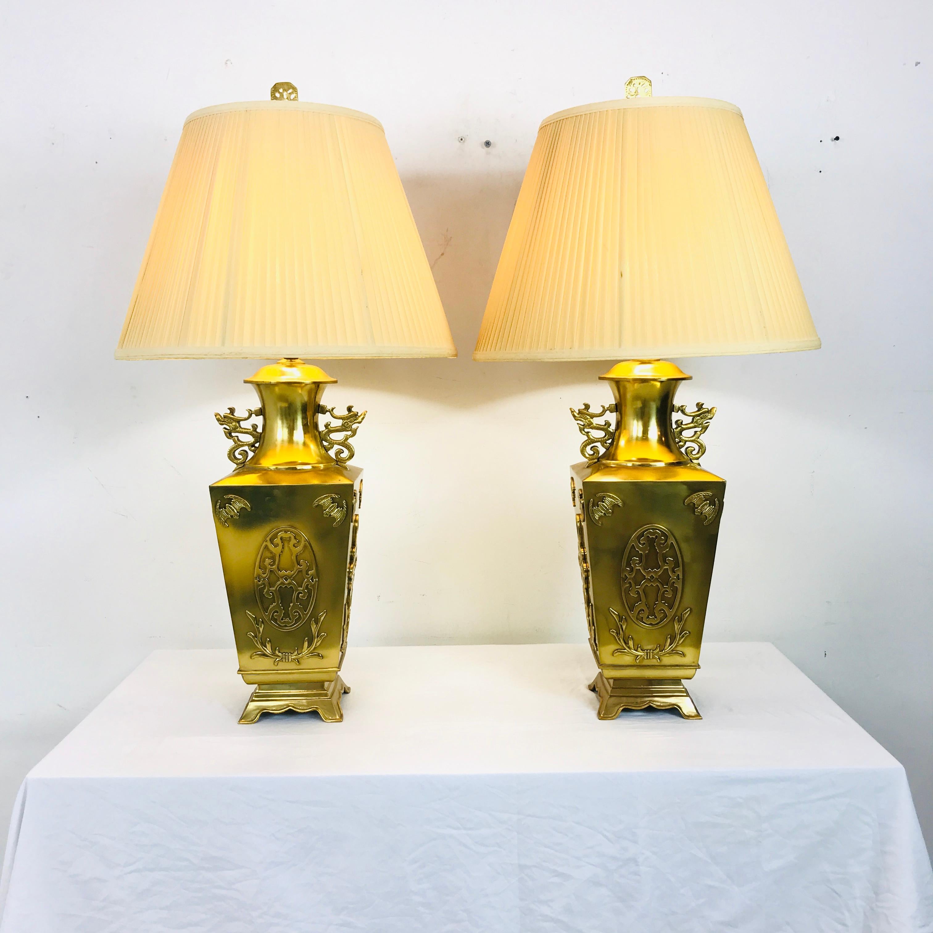 Pair of unique brass Asian lamps with bat detail. Measures 39