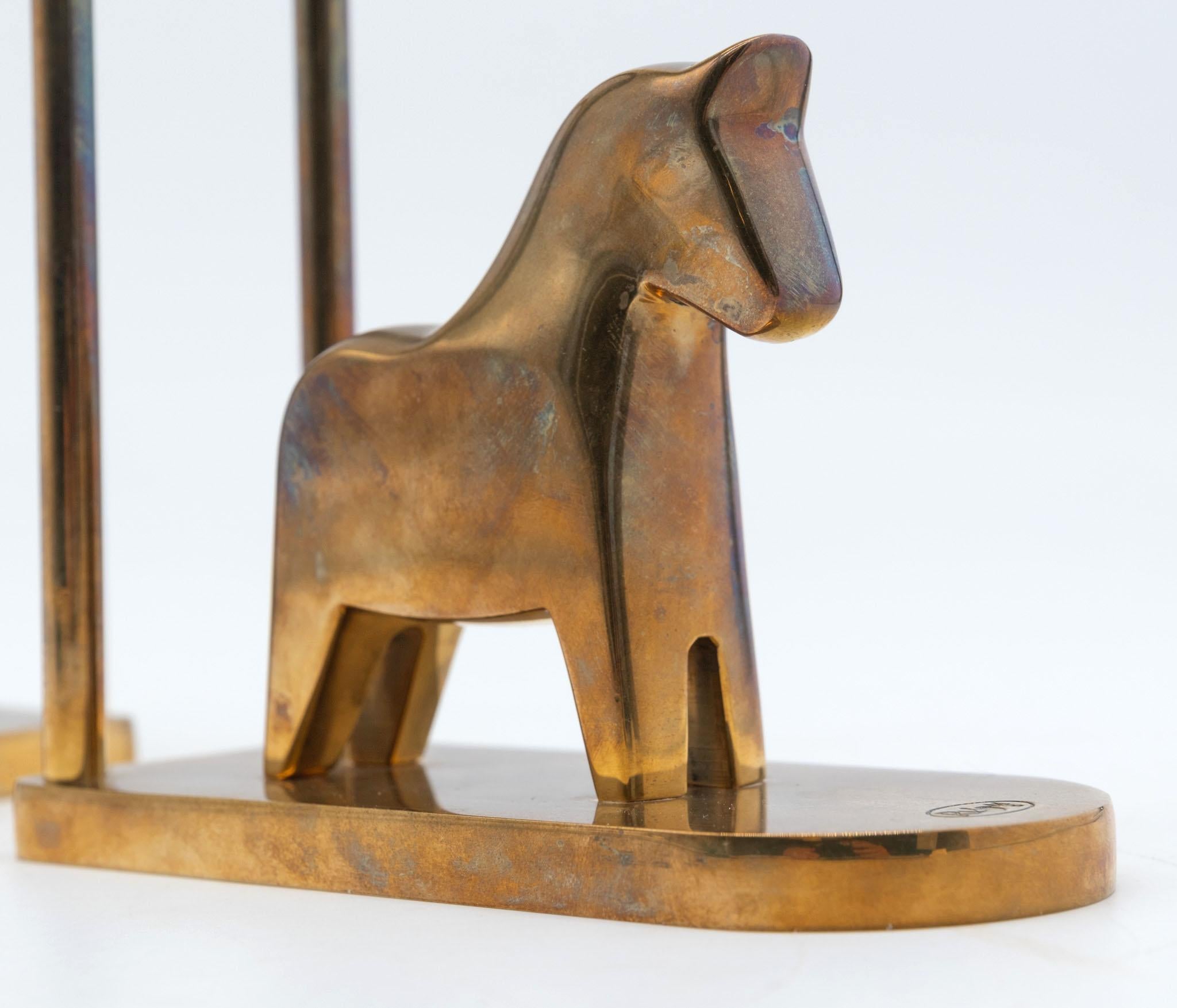 Pair of brass bookends modelled as horses by Lotta Horn for Rejmyre Mässingsbruk. Sweden. Early 1990s. Stamped marks.

They are richly patinated and in good condition, showing a few light signs of use.

In the early 1990s, Lotta Horn was the design