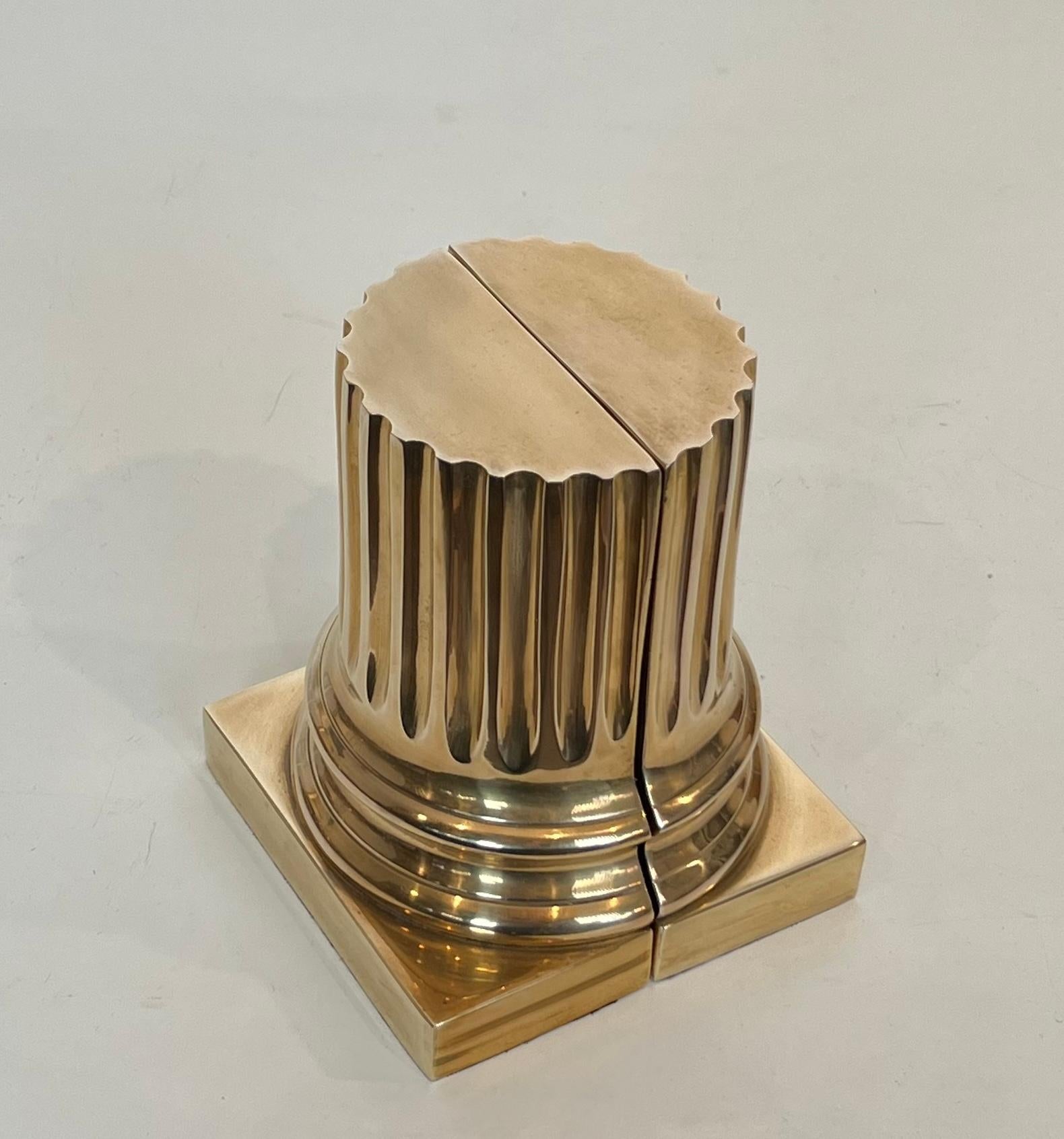 This very nice and heavy pair of bookends are made of brass and are representing columns. This is a French work. Circa 1980