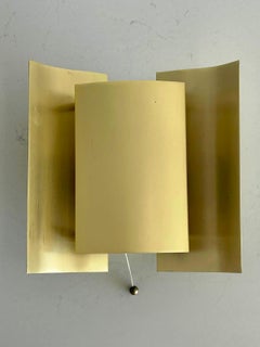 Pair of brass butterfly-shaped wall lights, minimalist design