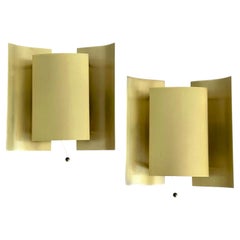 Pair of brass butterfly-shaped wall lights, minimalist design