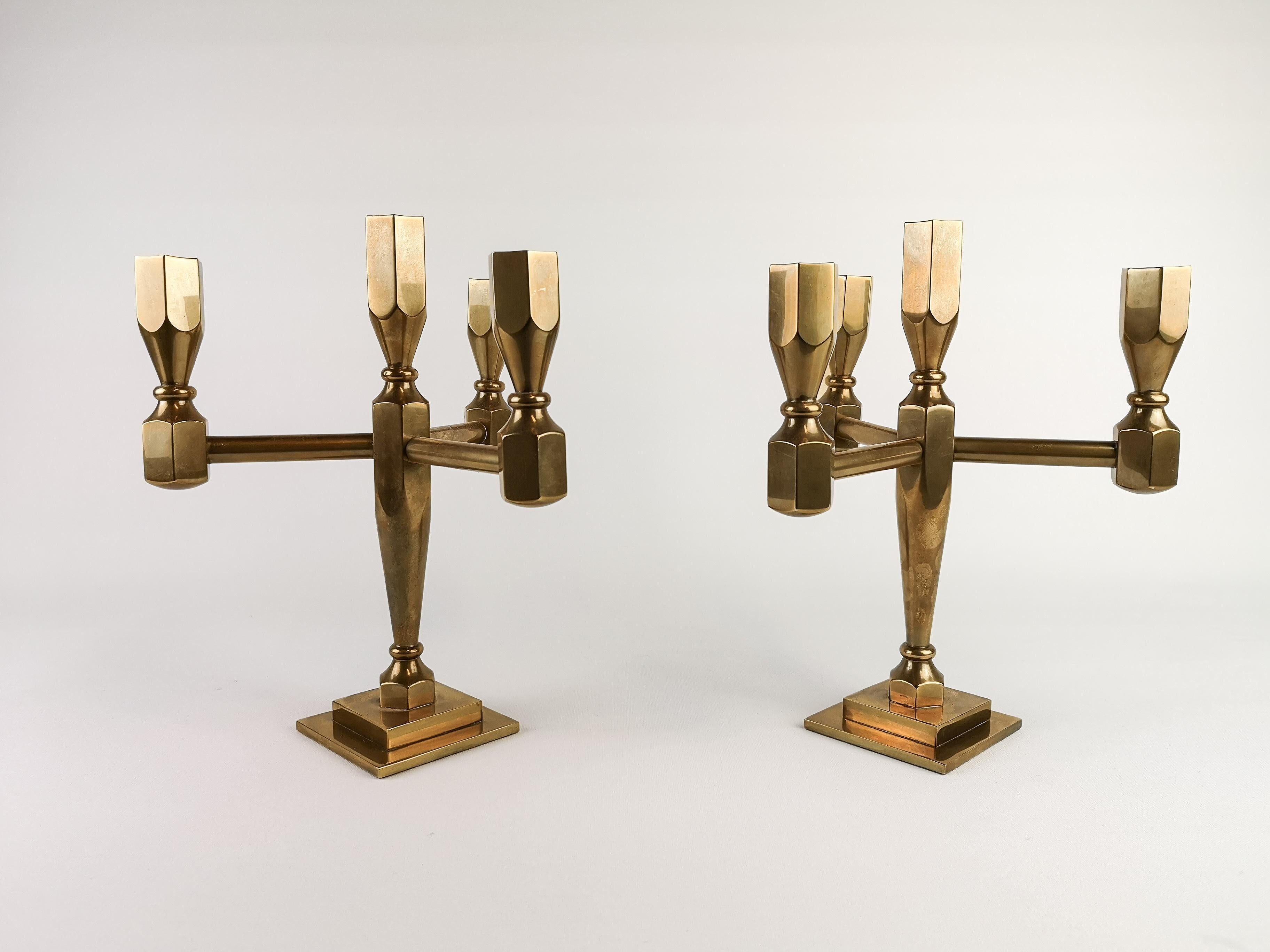 Handsome pair of brass Gusums Bruk candelabras with 4 holders on each one. Stamped GoProduct AS Gusum also numbered on each and manufacture year.

Very nice vintage condition.