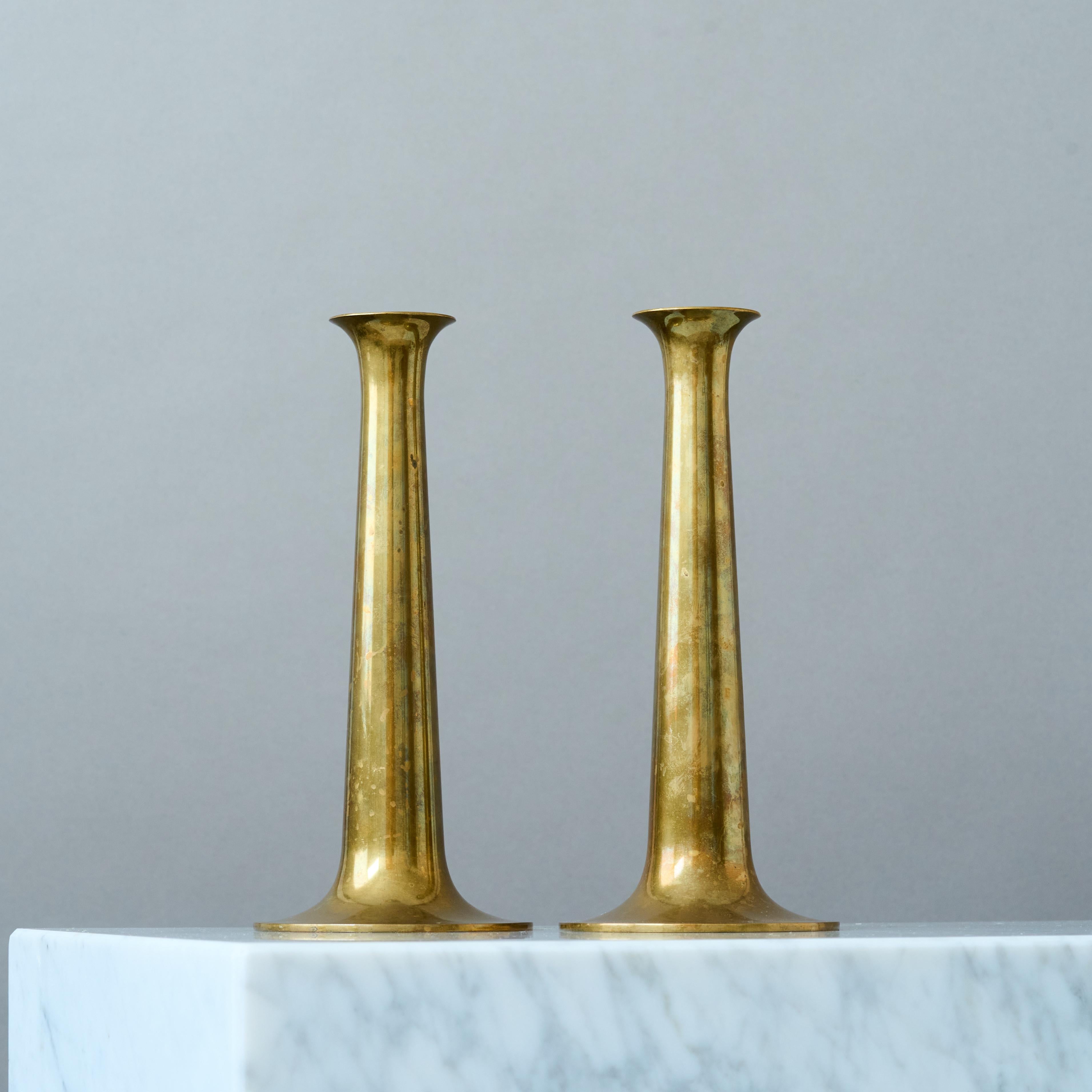 A pair of vintage solid brass trumpet candlesticks. With original aluminium inserts.
Designed by Hans Bolling and made by Torben Örskov, Denmark, 1960s.

Great original condition with amazing patina. If you prefer them shiny you can easily polish