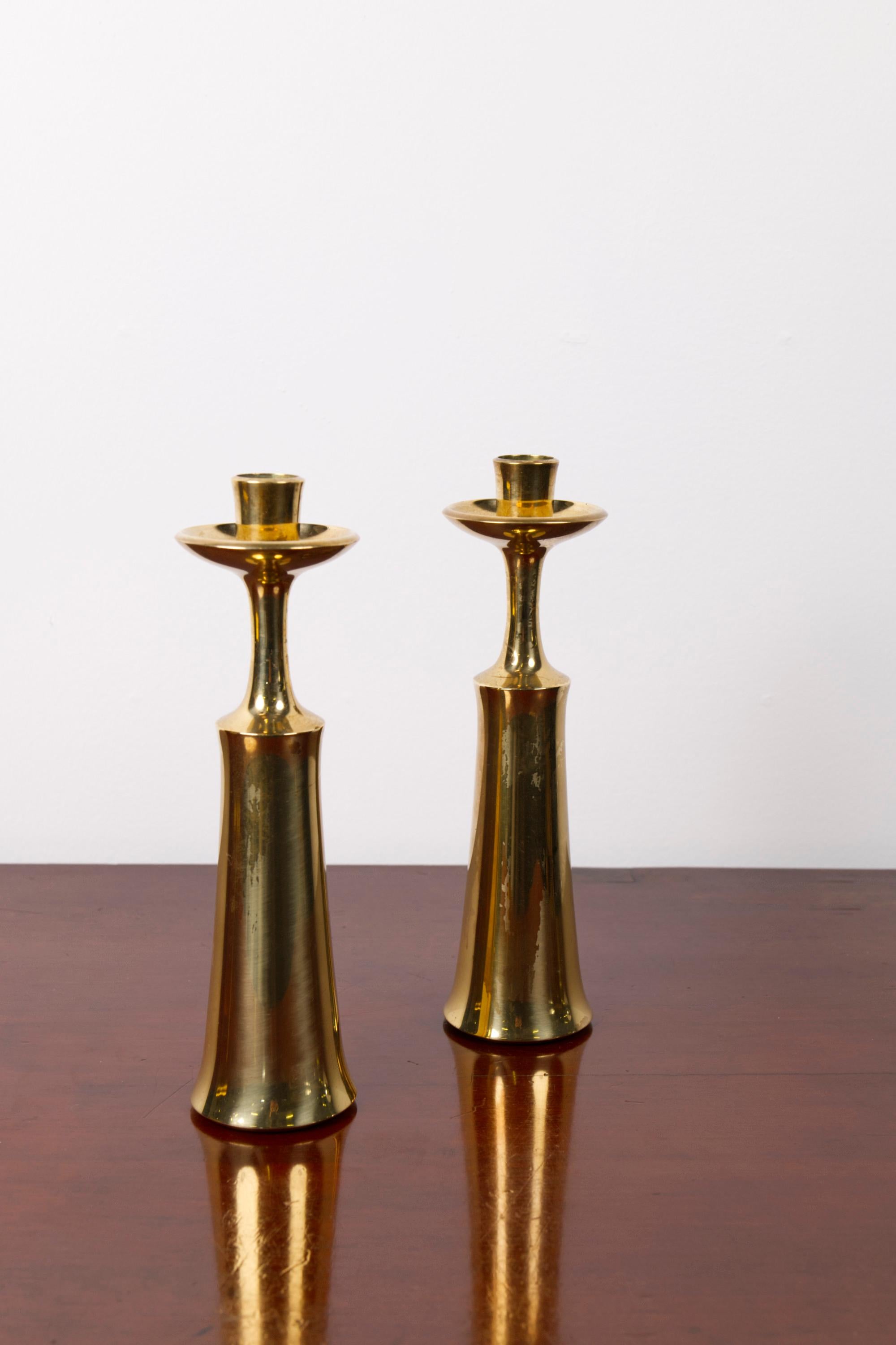 Pair of Brass Candlesticks by Jens H. Quistgaard for Dansk Design, Denmark.

Designed in 1956 by Jens H. Quistgaard for Dansk Design, this elegant pair of brass candlesticks exemplifies the refined minimalism and sculptural clarity that defined