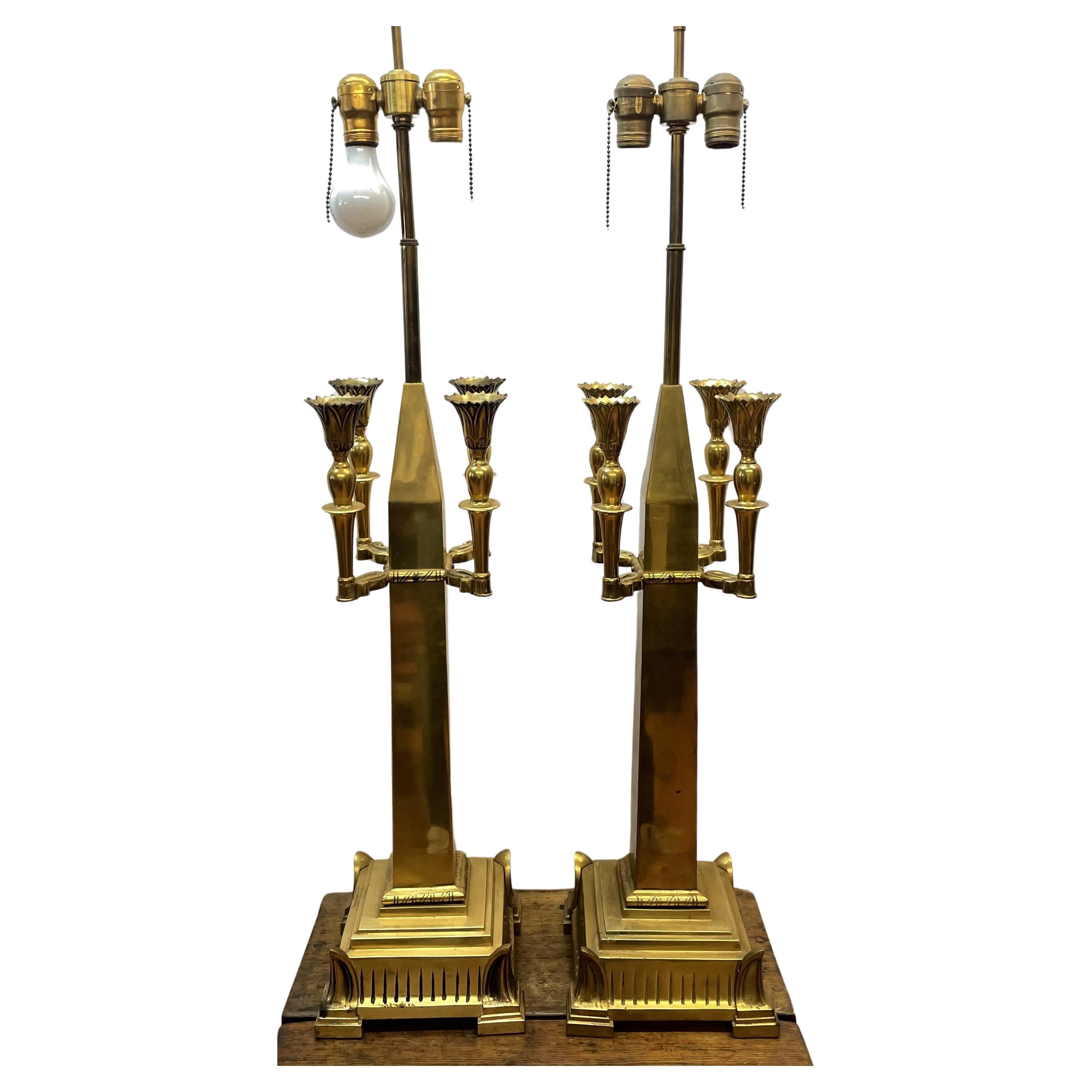 Pair of brass cathedral-style lamps with four candleholders each