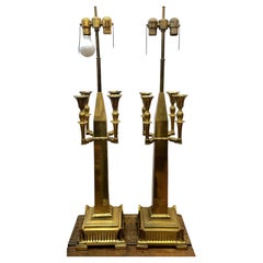 Pair of brass cathedral-style lamps with four candleholders each