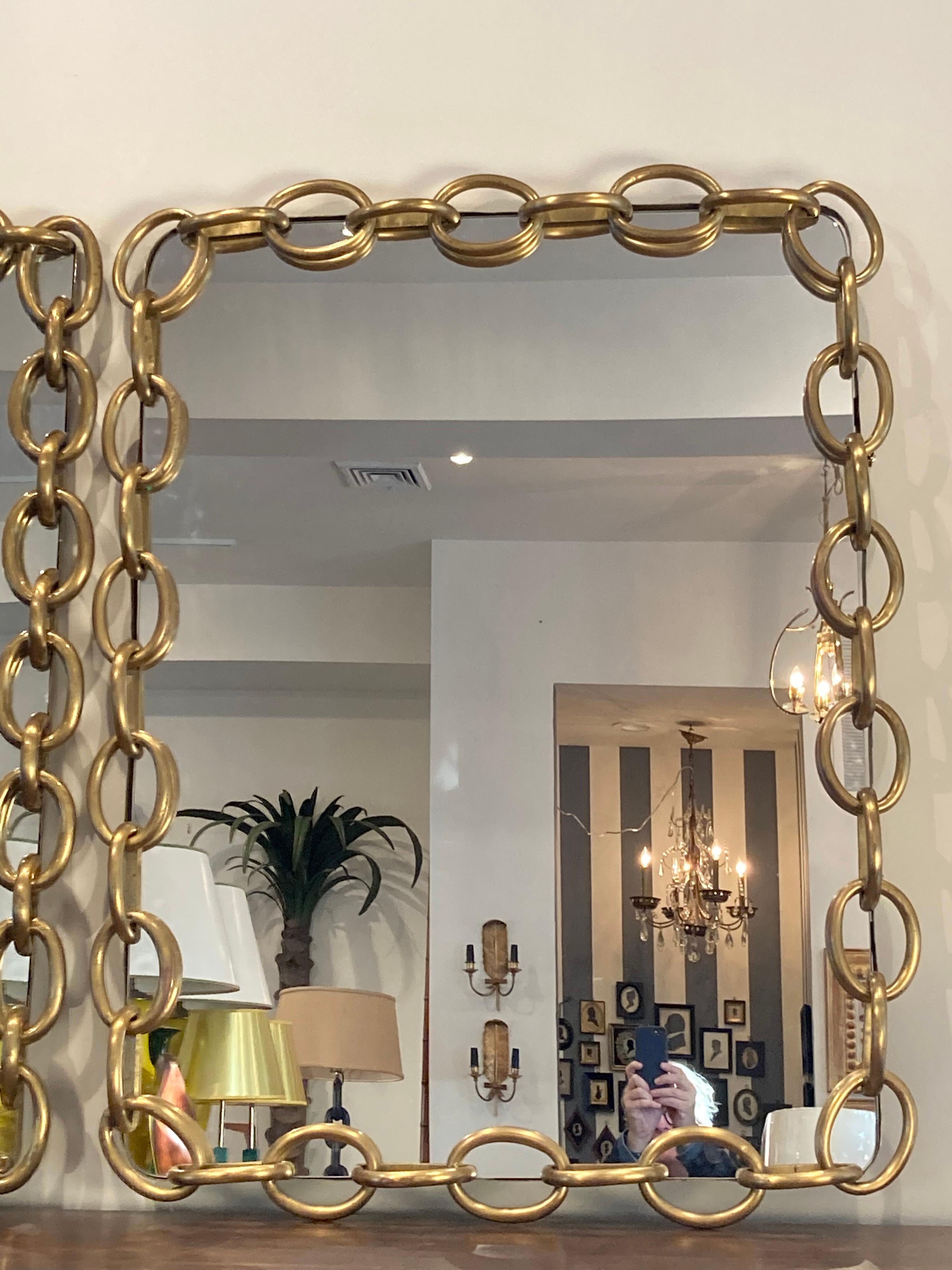 Fabulous pair of brass chain link framed mirrors.... sold separately or together.... so exceptional, like jewelry.... they are not exactly the same but very close cousins.... a rare find!