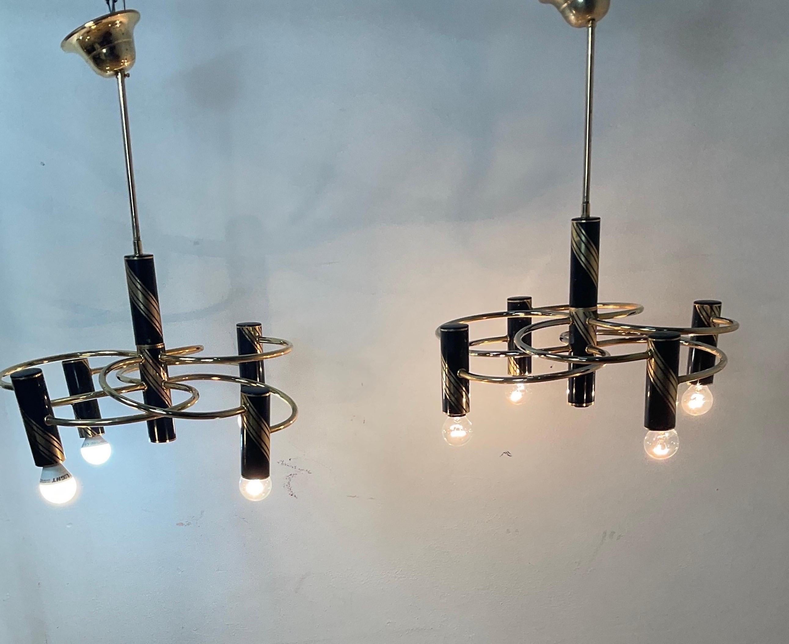 Pair of brass chandeliers by Gaetano Sciolari, 1970s. Chandelier consisting of 5 lights in good condition, wired power.