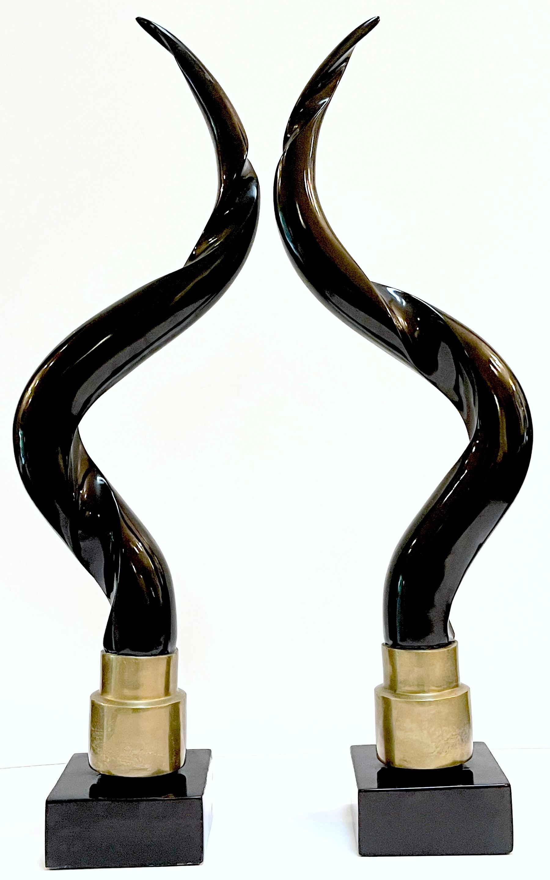 Pair of Brass and Chocolate Brown Lacquer Antelope Horns, Style Springer 
USA, circa 1980s

A striking pair of brass and chocolate brown lacquer antelope horns, embodying the distinctive style reminiscent of Karl Springer and originating from the