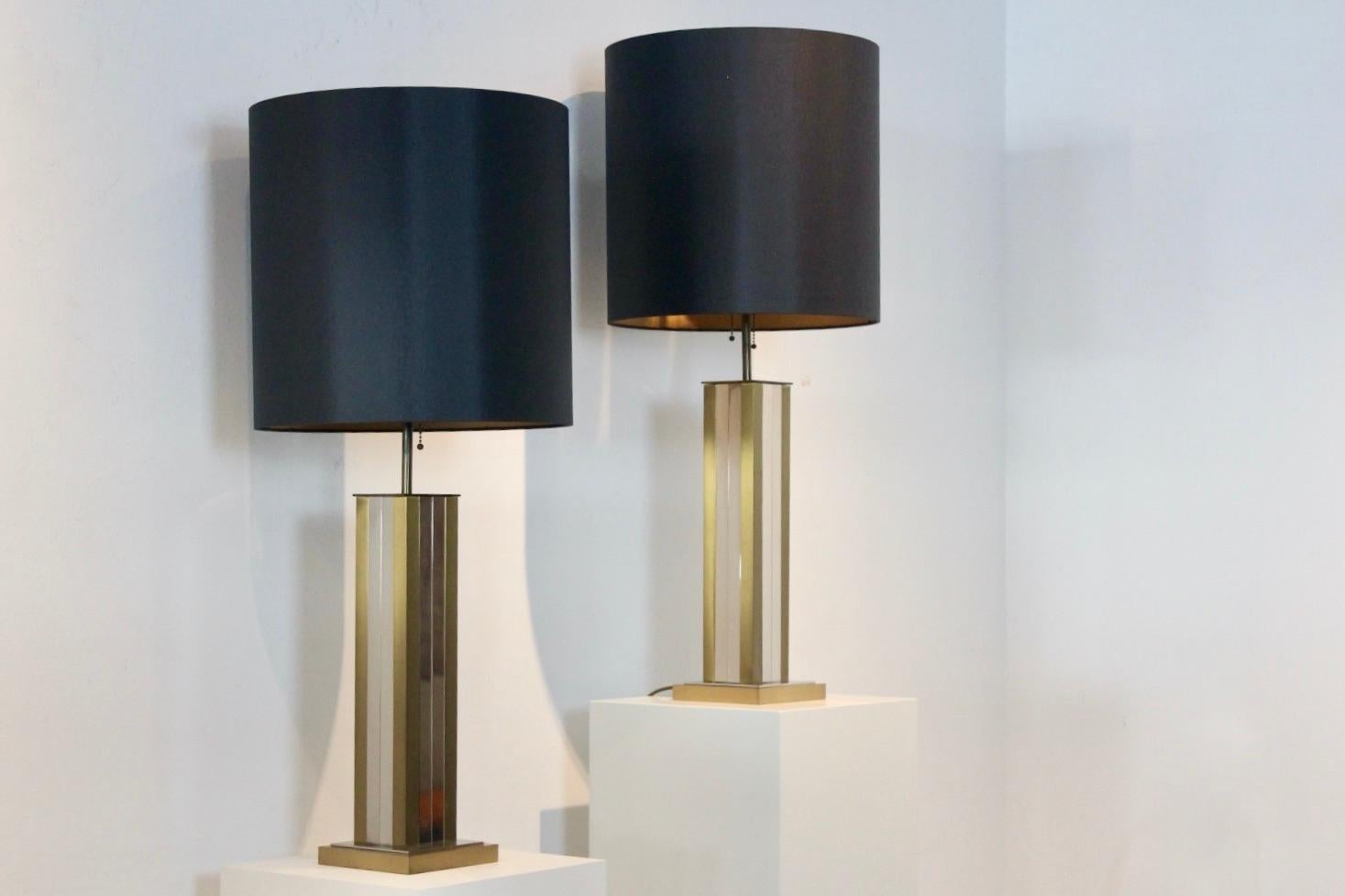 Beautiful pair of large brass and chrome midcentury table lamps from the 1970s by Willy Rizzo. The set is unique and has a glamorous appearance and has 2-light per lamp. The beautiful shades are new and give a very sophisticated and warm light with
