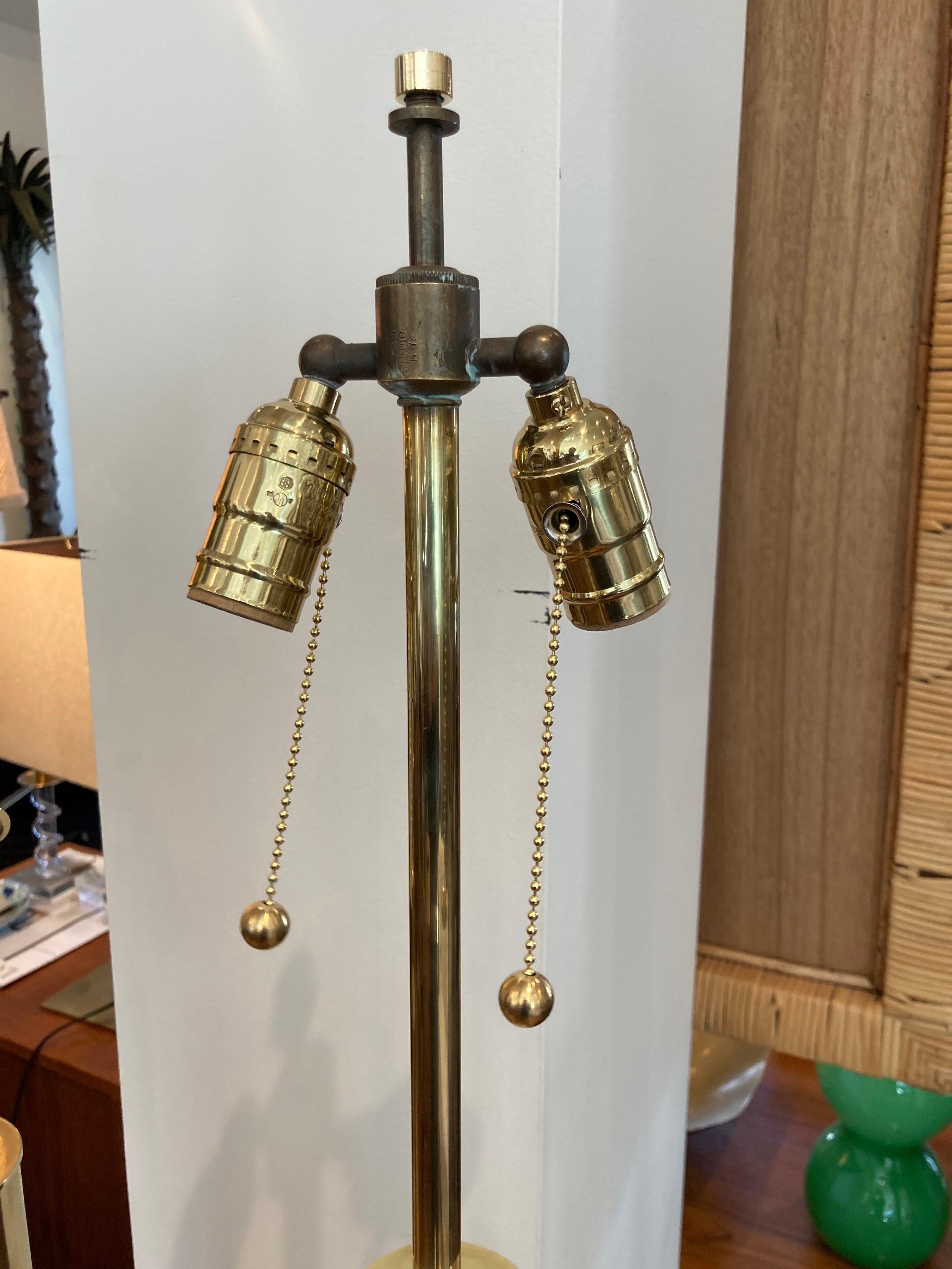 Brass tubular column lamp on slate bases, newly rewired with silk covered wire.