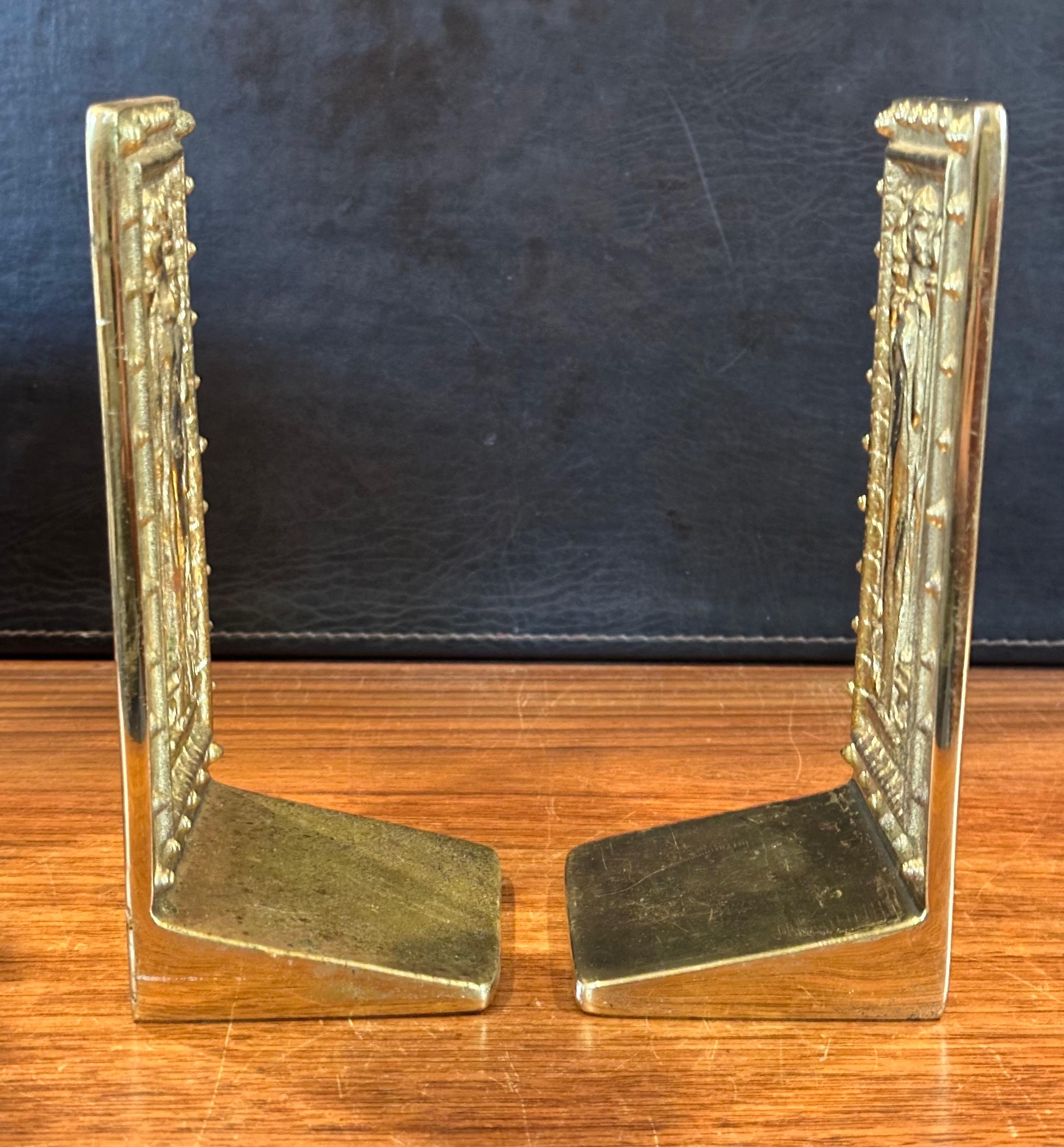 Coppia di fermalibri in ottone 