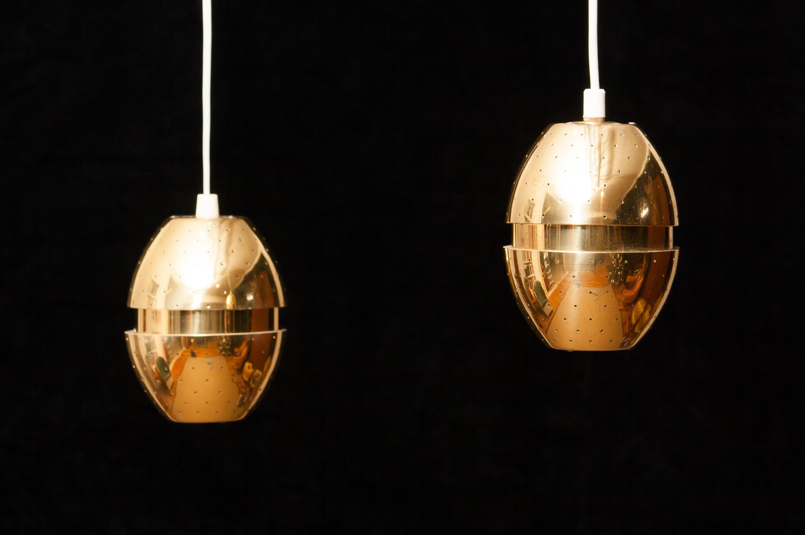 A beautiful pair of pendant lights designed by Hans-Agne Jakobsson, Sweden.
These lamps are made of brass and are perforated with gives a very nice shining.
They are in excellent condition.
Period 1950s
Dimensions: H 14 cm, ø 12 cm.