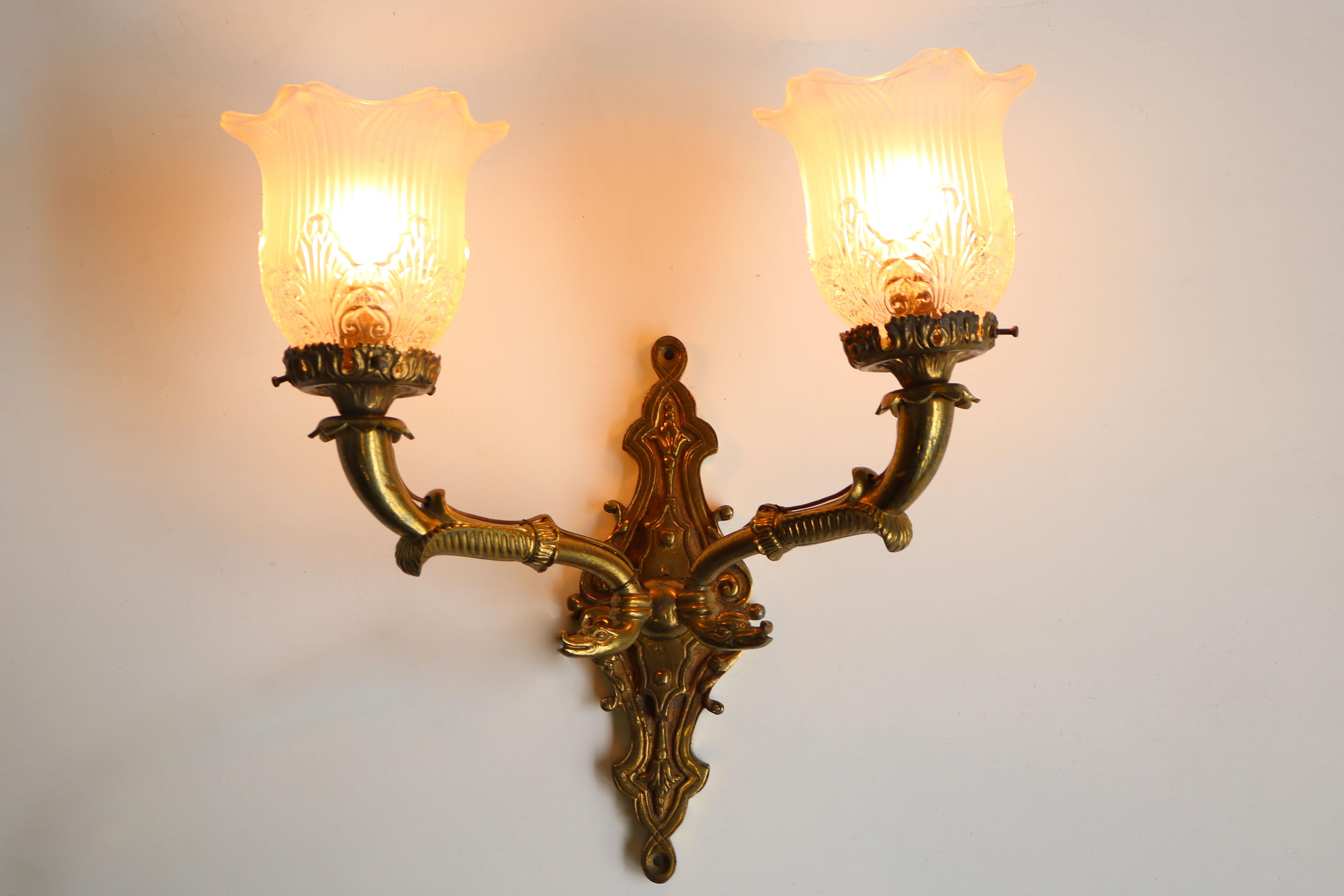Pair of gorgeous large Empire 19th century wall lights in brass with clear & frosted glass shades. 
They have a real royal & luxury feeling and looking amazing when lit ! 
Fully original and stunning with Serpent head details. 
Each wall light