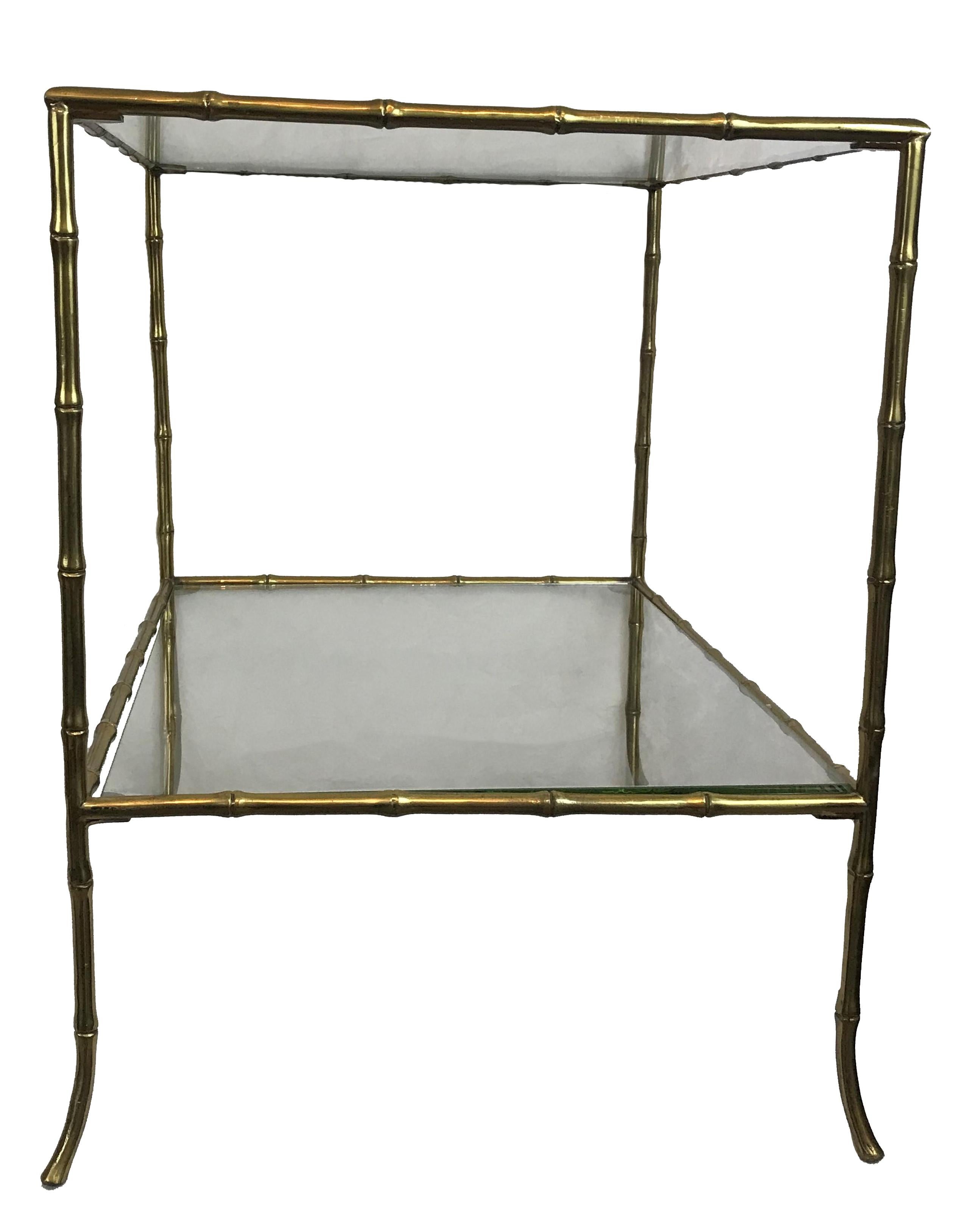Pair of midcentury French two-tier brass faux bamboo side tables. Clear glass inserts.