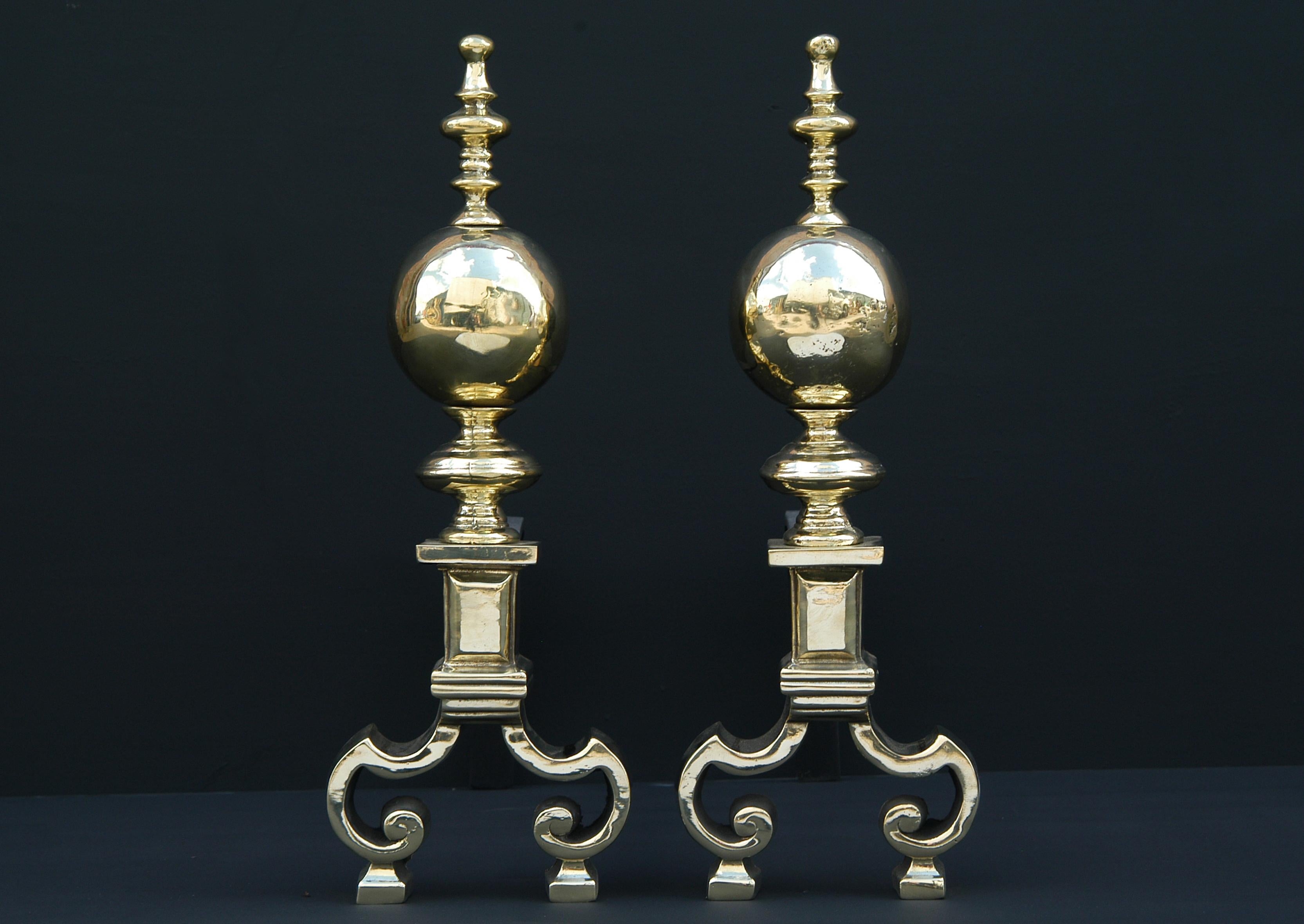 A pair of brass firedogs with balls to finials and break leg design to bases. 

N.B. May be subject to an extended lead time.

Measures: 
Height:	485 mm      	19 1/8 in
Width:	165 mm      	6 1/2 in
Depth:	475 mm      	18 3/4 in