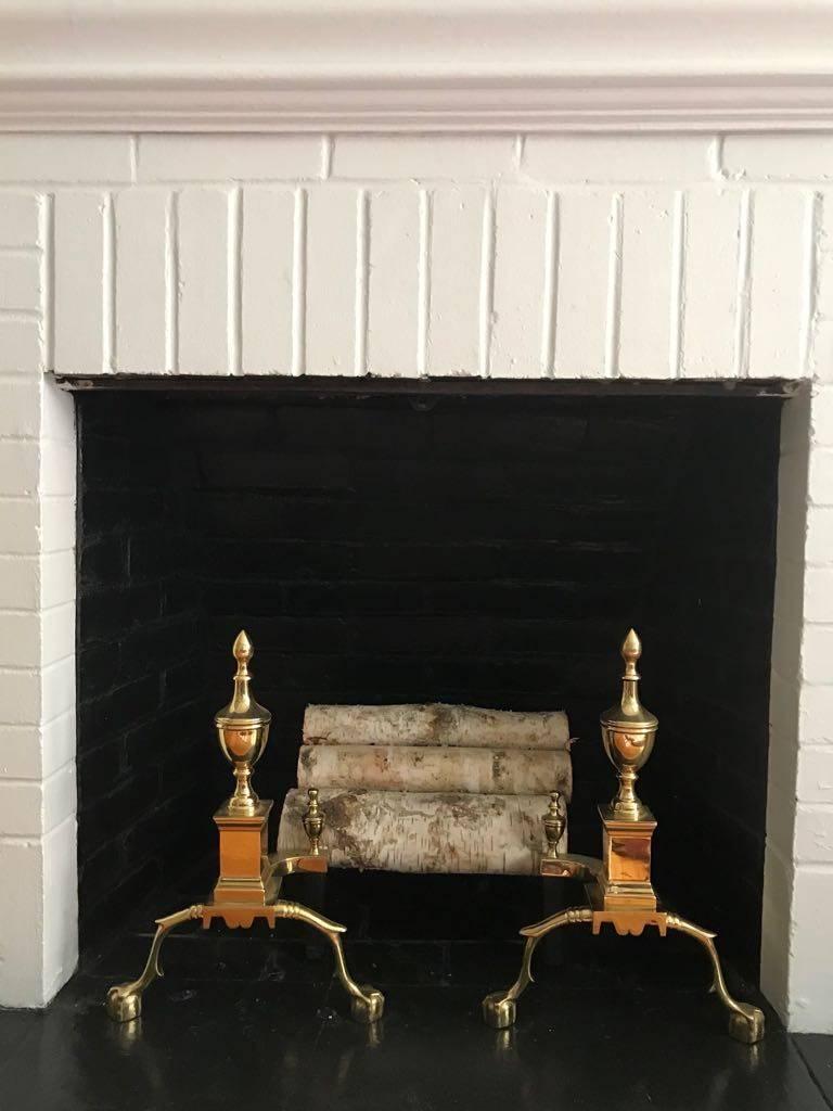 Classic pair of brass andirons, great size and presence.