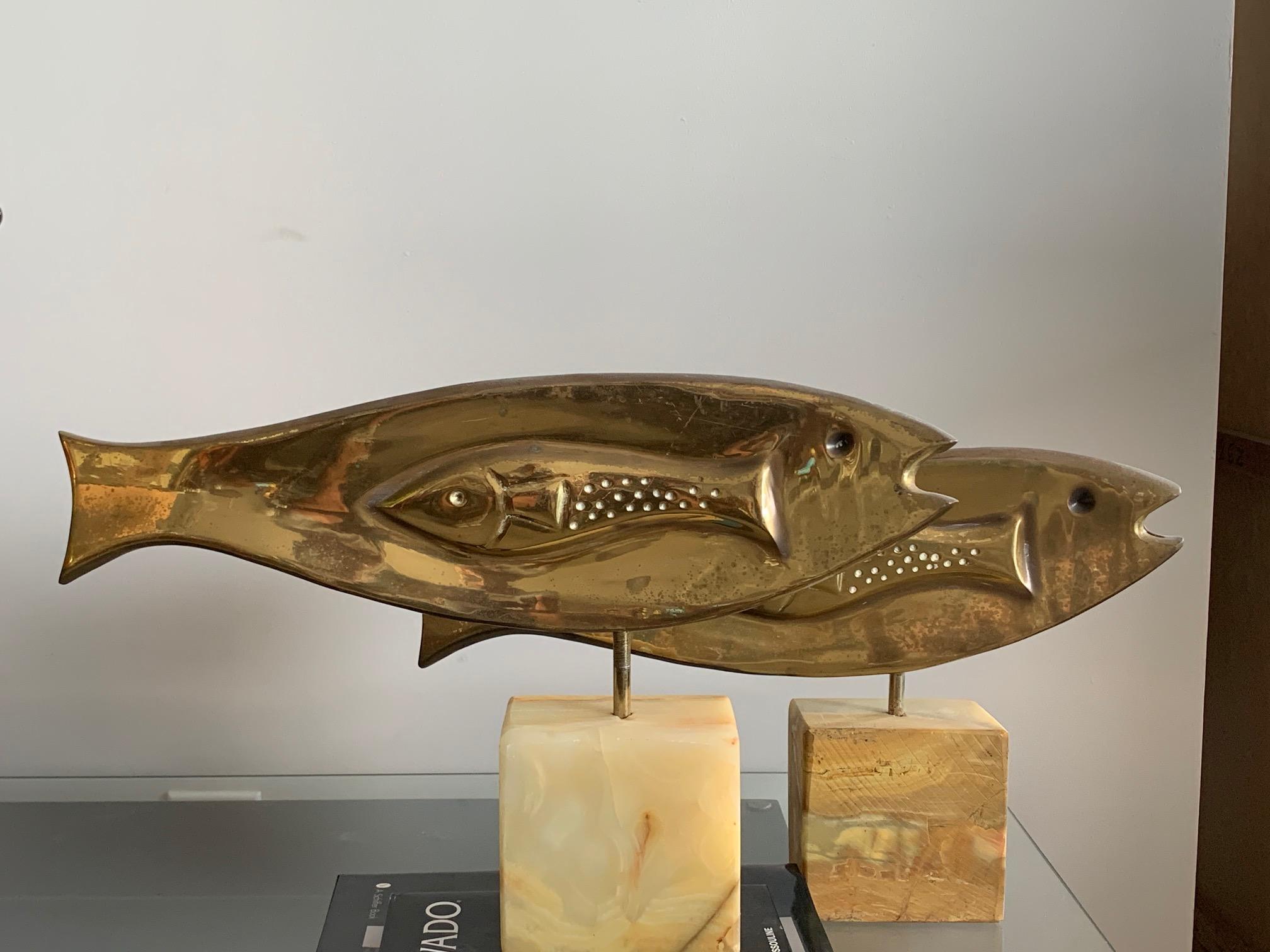 A pair of unusual fish sculptures by C. Jere, 1981. Polished brass, alabaster bases. Each measures approximately 19