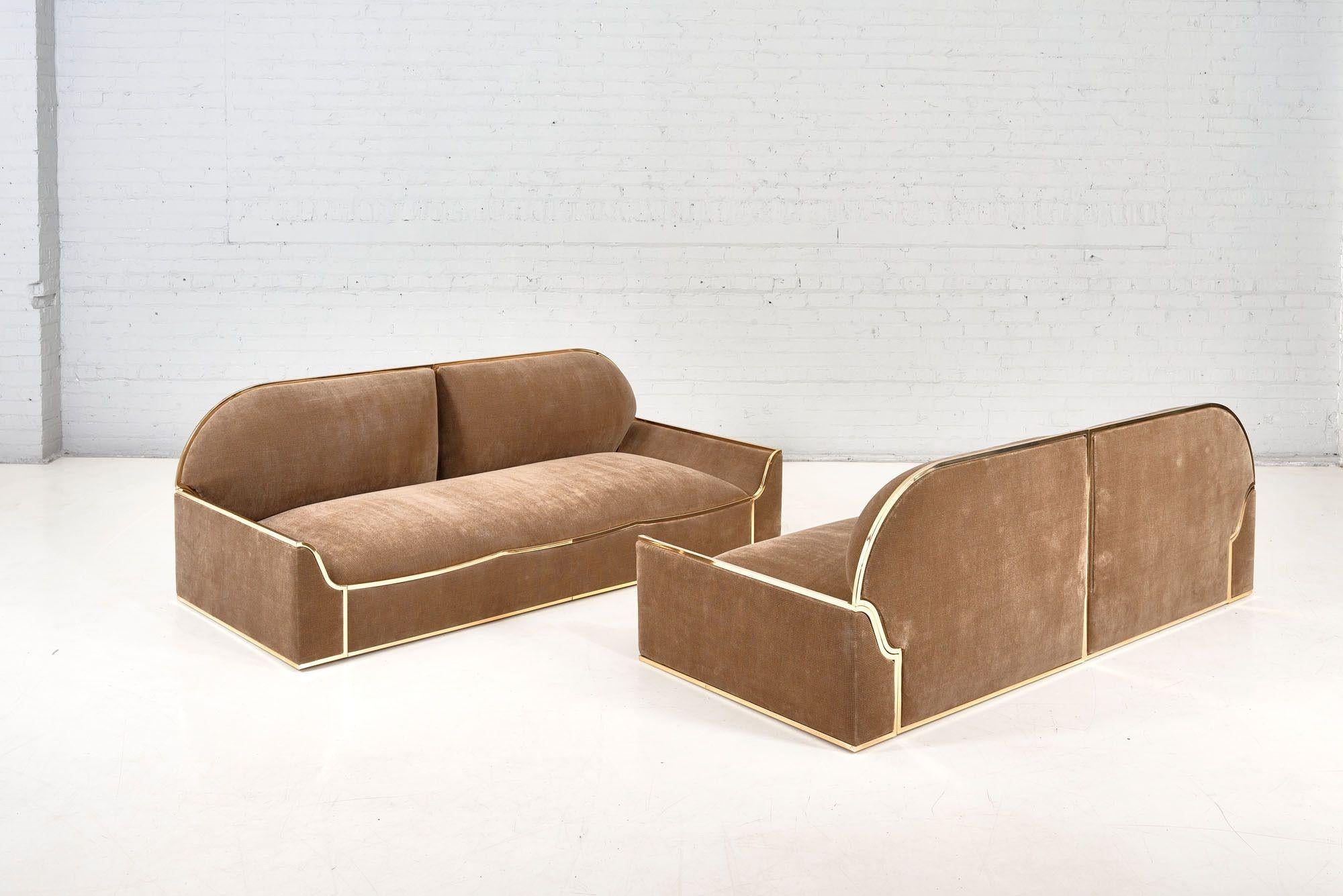 Pair of Brass Low Frame sofas circa 1960. Restored and newly reupholstered.
Sofa's measure 92