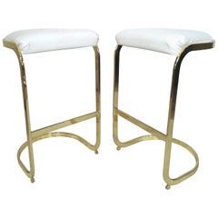Zwei Hocker mit Messinggestell