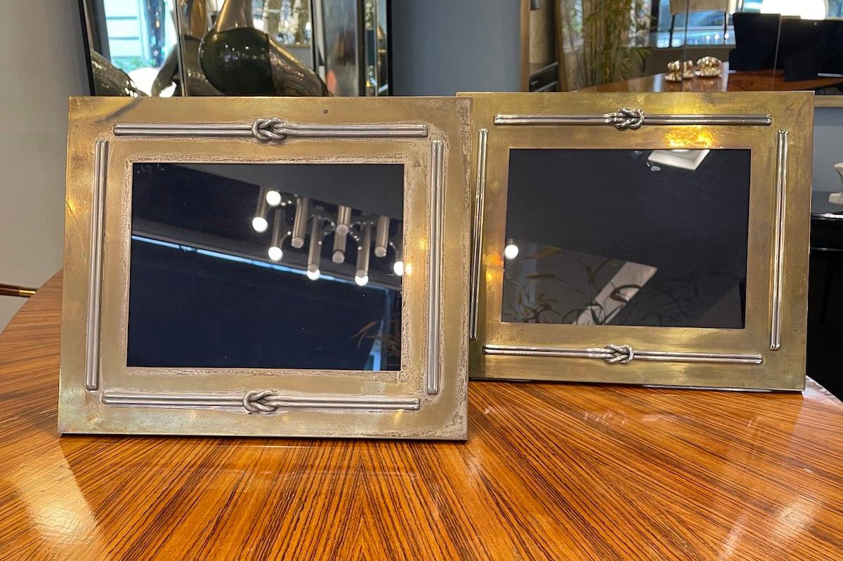 A pair of brass frames with detailed accents on the front portion. 
The back is fully covered in blue velvet. 

Measurements: W 36 cm x H 31.5 cm x D 1 cm.

Price INCLUDES the costs for any packaging and crates needed to protect the item and keep
