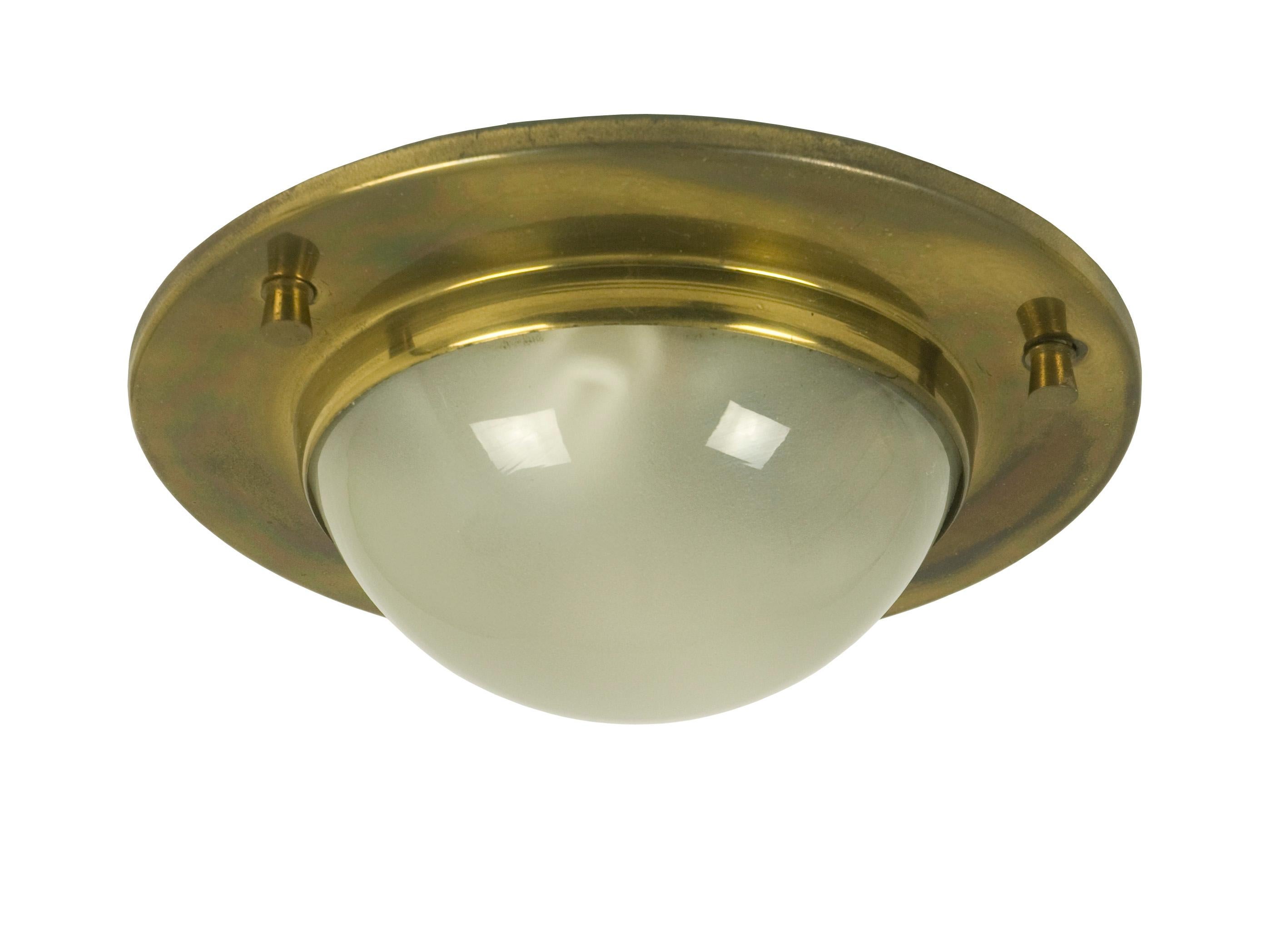 This set consists of 2 wall or ceiling lights made from brass and sandblasted glass. The lamps were produced in the late 1950s in the style of the famous Luigi Caccia Dominioni model 